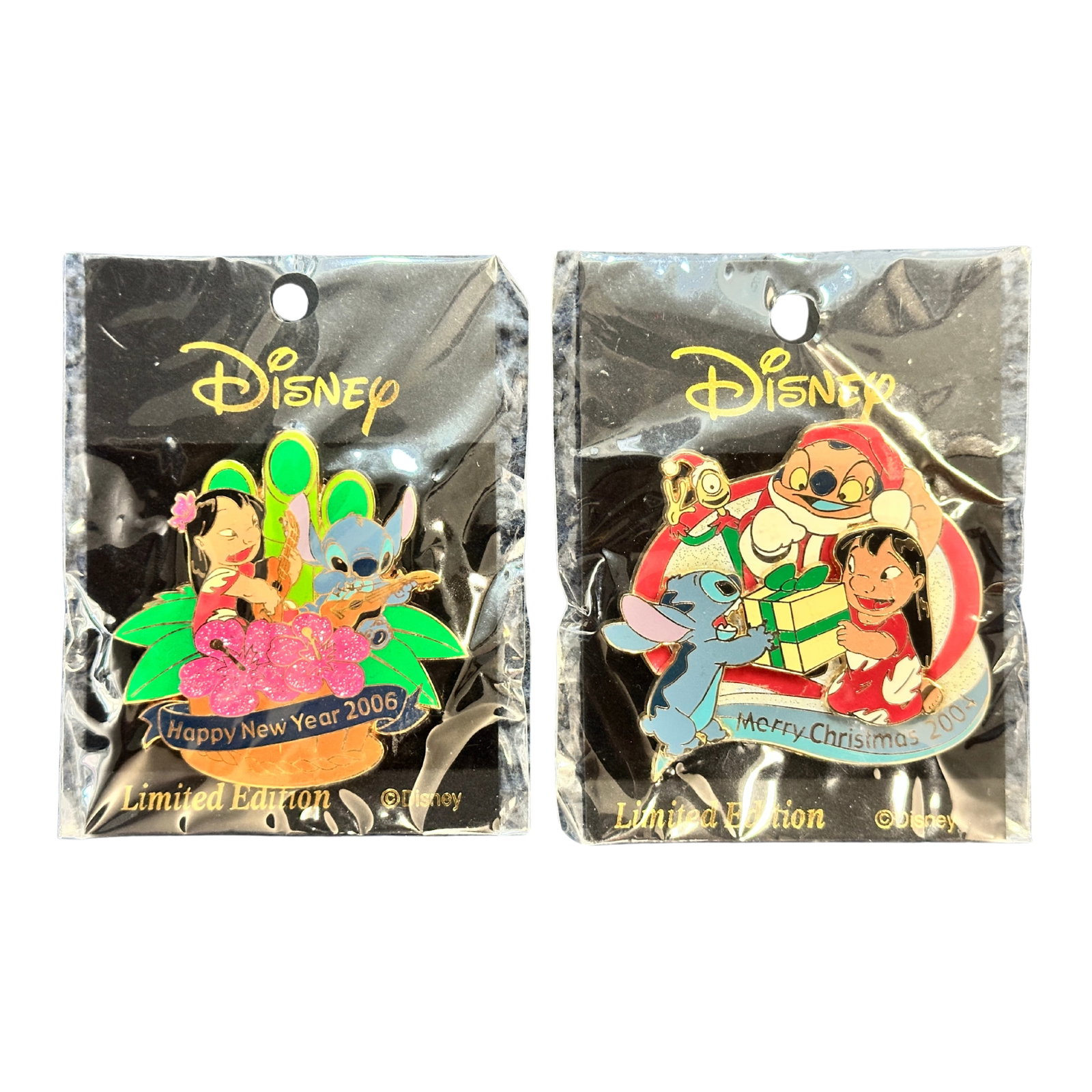 Disney M&P Lilo & Stitch Merry Christmas 2004 & Happy New Year 2006 Pin Lot Of 2: A Disney M&P Lilo & Stitch Holiday pin lot of 2. The Happy New Year pin features Lilo and Stitch playing the ukulele. The Merry Christmas pin features Lilo, Stitch, Jumbaa, & Pleakly opening a present