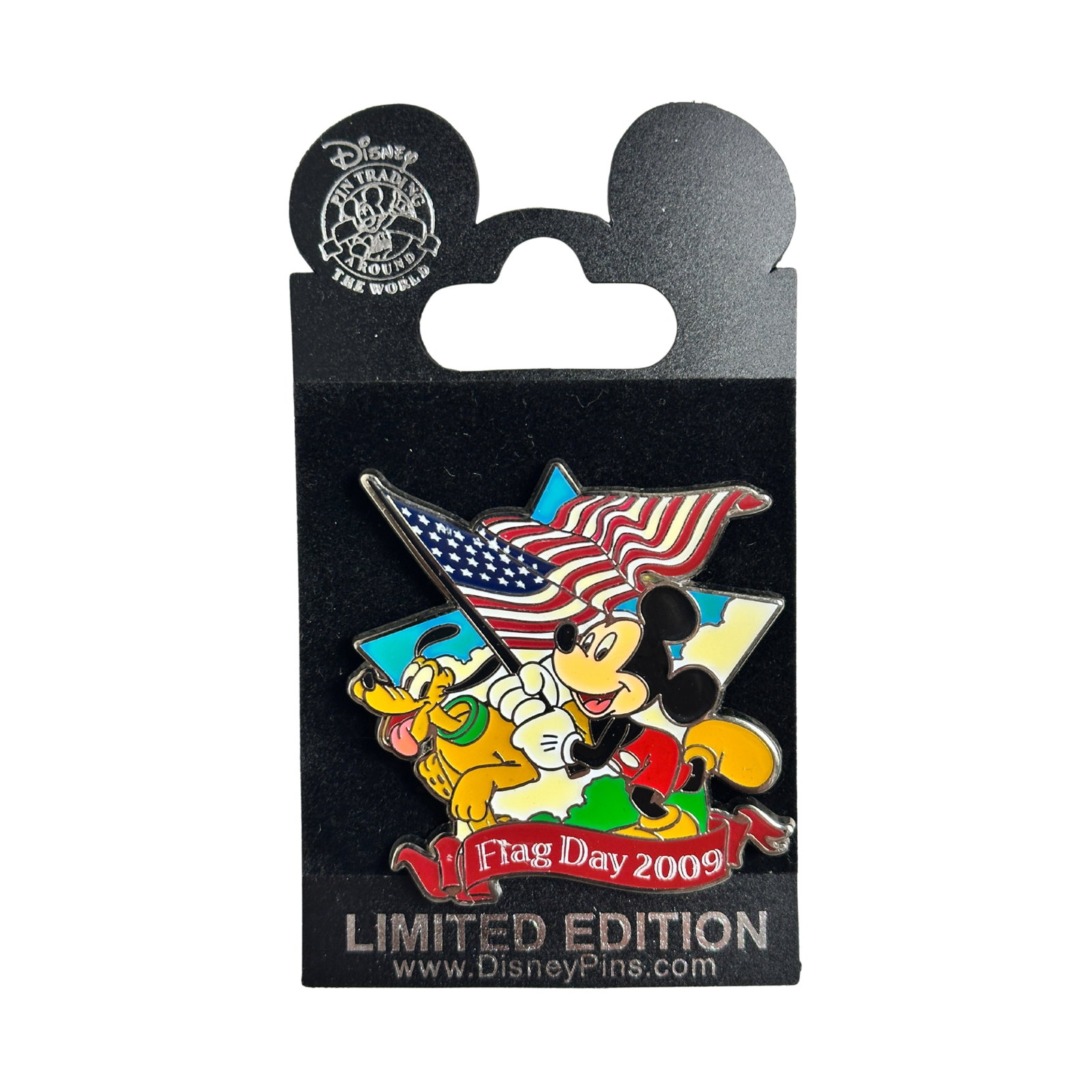 Disney Flag Day 2009 Patriotic Mickey and Pluto Pin: Disney Flag Day 2009 Patriotic Mickey and Pluto Pin. This Limited Edition pin features Mickey Mouse and Pluto celebrating Flag Day 2009.Mickey is wearing his red shorts and carrying the American flag 