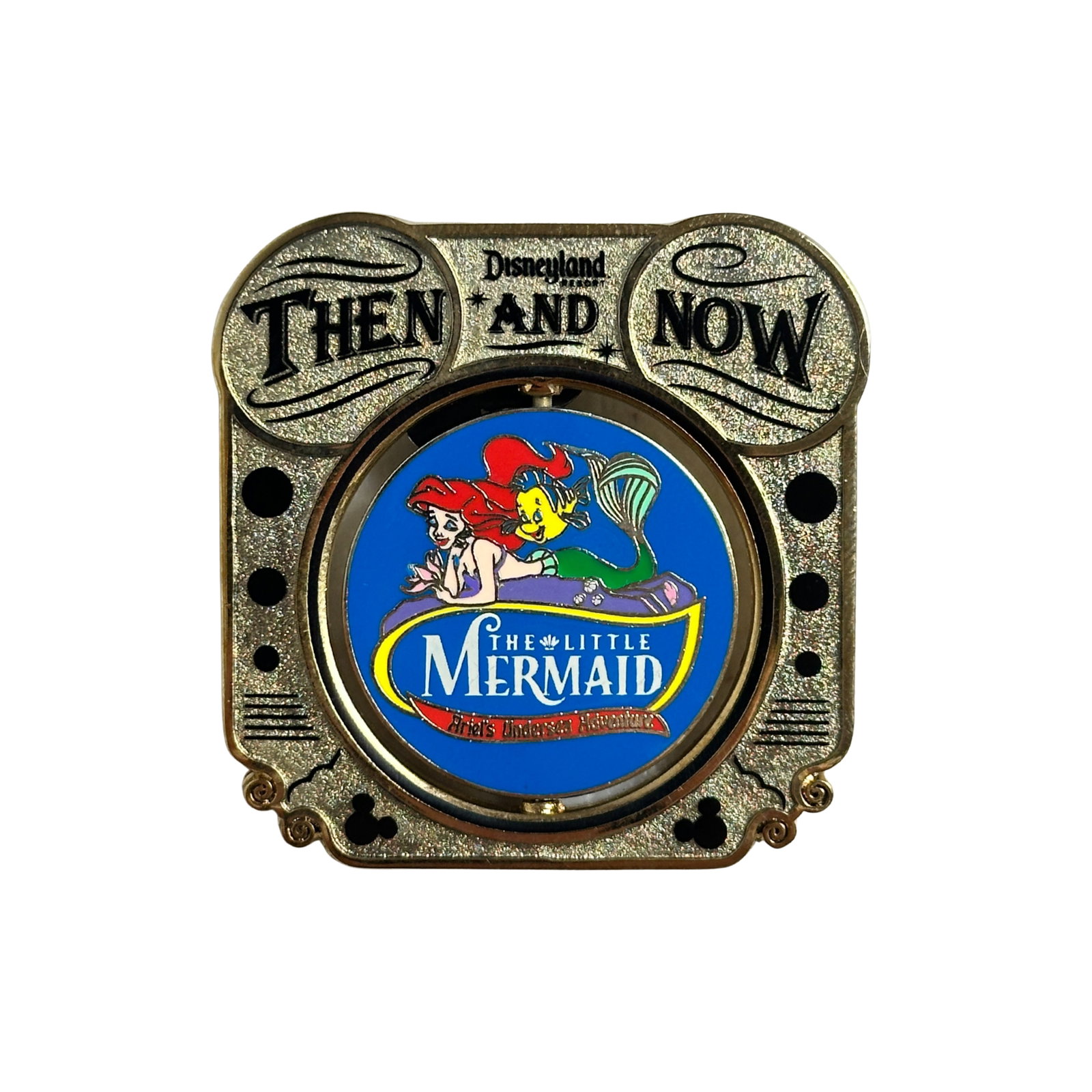 Disney DLR Then & Now Golden Dreams And Ariel's Undersea Adventure Pin: Disney DLR Then & Now Golden Dreams And Ariel's Undersea Adventure Pin. This pin features the Golden Dreams Attraction which will be replaced by the Ariel's Undersea Adventure Attraction at Disney's C
