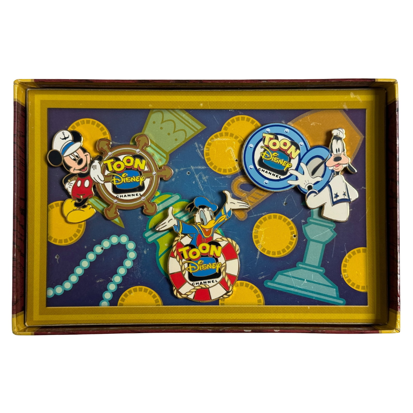 Disney TDC Toon Disney Channel Boxed Pin Set Of 3: Disney TDC Toon Disney Channel Boxed Pin Set Of 3. Little is known about this 3-pin boxed set, promoting the Toon Disney Channel. It came in a box shaped like a treasure chest, with the "Toon Disney C