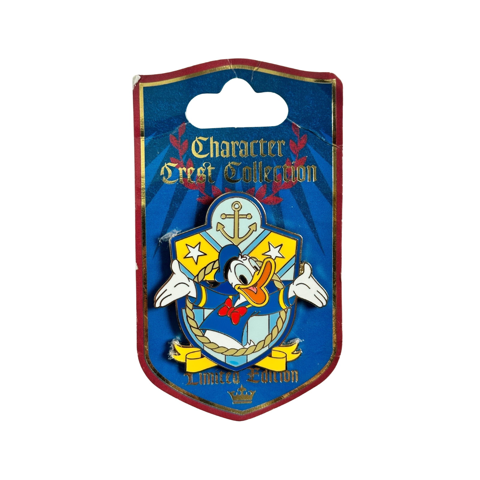 Disney WDW Character Crest Collection Donald Duck Pin: Disney WDW Character Crest Collection Donald Duck Pin. This limited edition pin features Donald Duck. Tyler Dumas from Disney Design Group created the artwork for this pin. This gold-finished pin is t