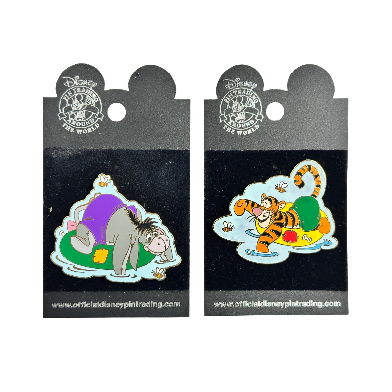 Disney WDW Winnie the Pooh & Friends Inner Tube Series Eeyore & Tigger Pin Lot Of 2: Disney WDW Winnie the Pooh & Friends Inner Tube Series Eeyore & Tigger Pin Lot Of 2. The first pin features features Eeyore, wearing purple trunks inside a green inner tube in the water wading around 