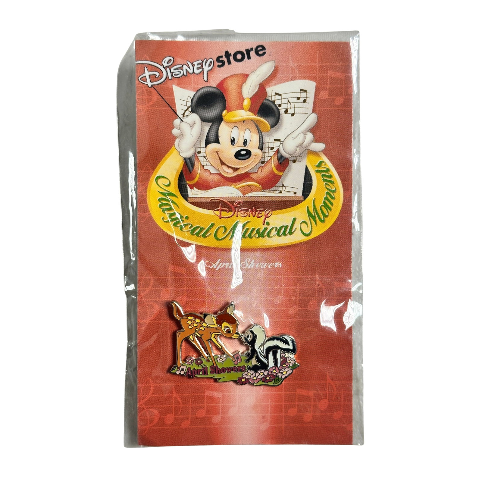 Disney DIS Magical Musical Moments Bambi April Showers Pin: Disney DIS Magical Musical Moments Bambi April Showers Pin. This is pin #93 in the series. It features Bambi and Flower nose to nose with the words "April Showers" in red underneath.*****FREE SHIPPING