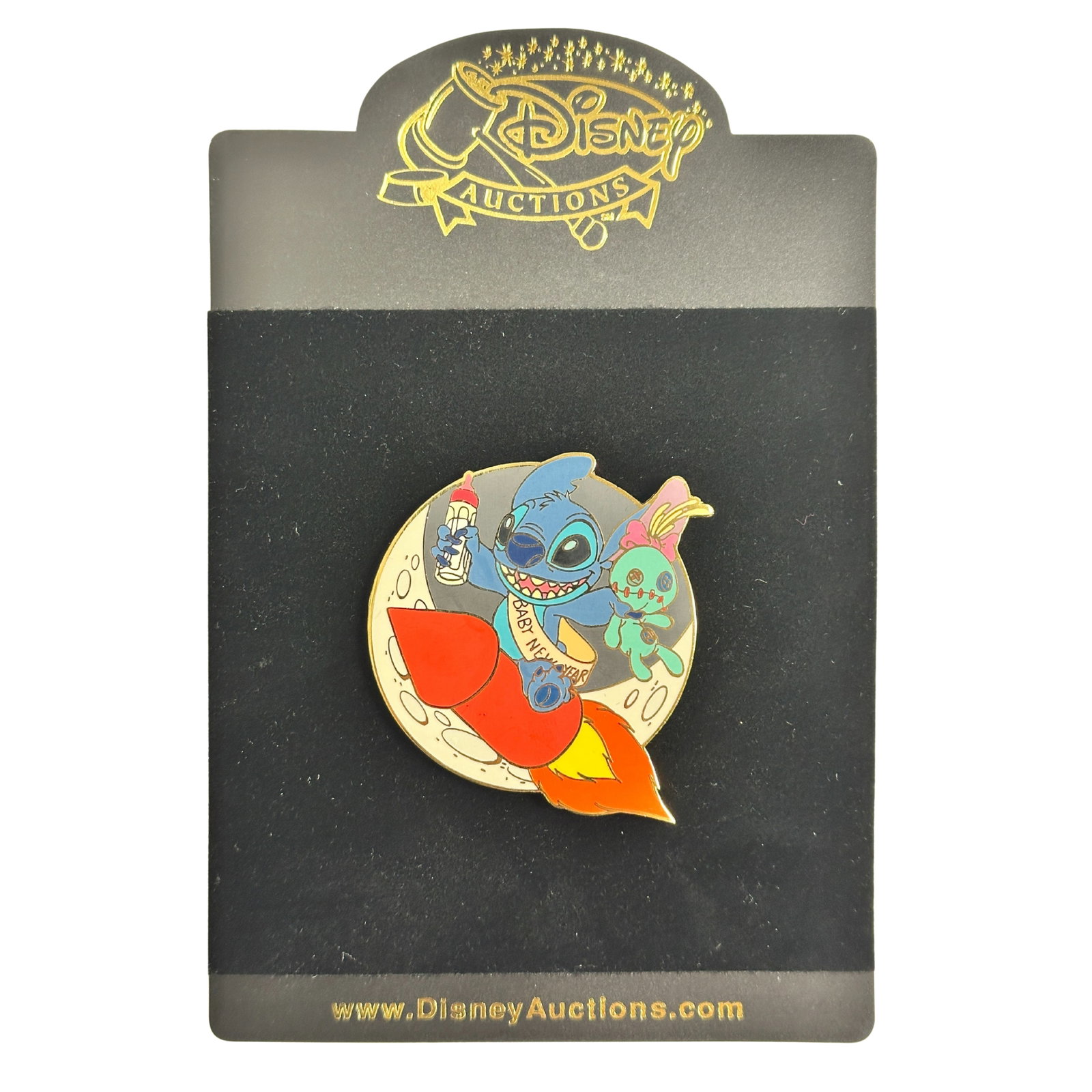 Disney Auctions Stitch Baby New Year Pin: Disney Auctions Stitch Baby New Year Pin. Accompanied by Scrump, Baby New Year Stitch celebrates the calendar's turn with fireworks on this gold-finished character pin, a Disney Auctions exclusive in 
