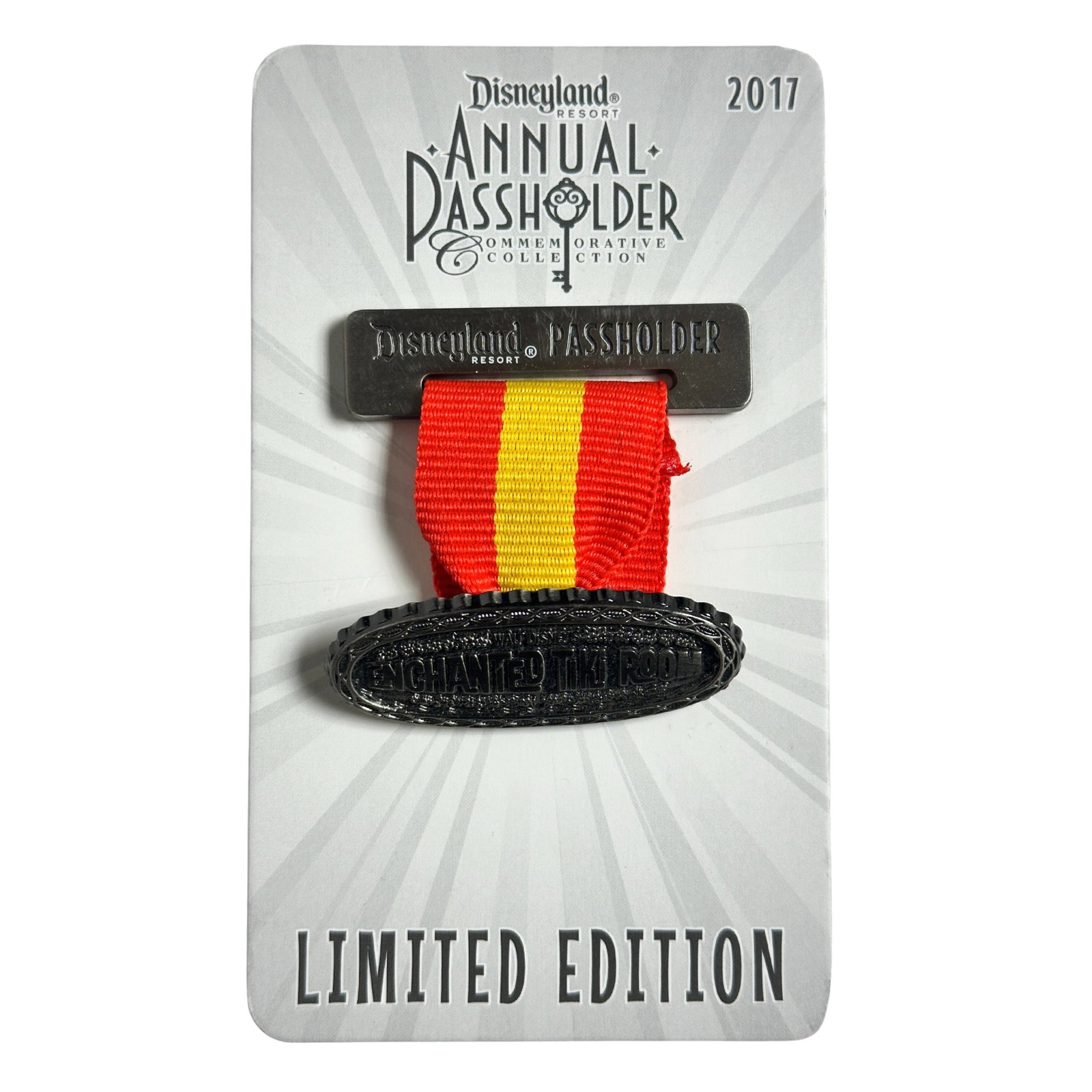 Disney DLR Enchanted Tiki Room Ribbon Annual Passholder 2017 Pin: Disney DLR Matterhorn Bobsleds Ribbon Annual Passholder 2017 Pin. This Annual Passholder pin looks like a ribbon medal or badge that hangs from a ribbon. At the top, the gold bar reads "Disneyland Pas