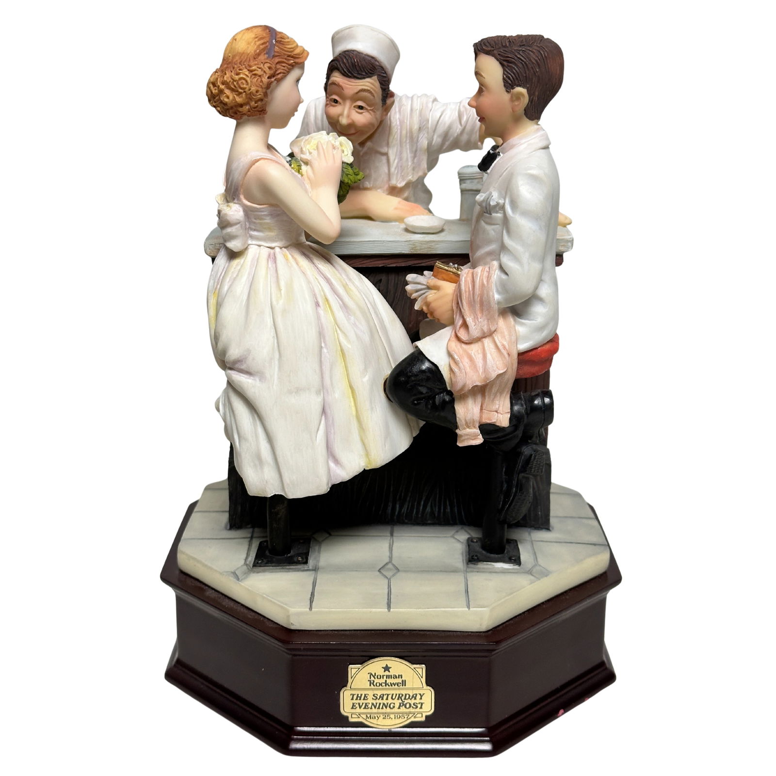 The Norman Rockwell The Saturday Evening Post "After The Prom" Music Box Sculpture Figurine: The Norman Rockwell The Saturday Evening Post "After The Prom" Music Box Sculpture Figurine. This sculpture depicts a young boy and girl dressed for the prom sitting next to each other at a old fashio