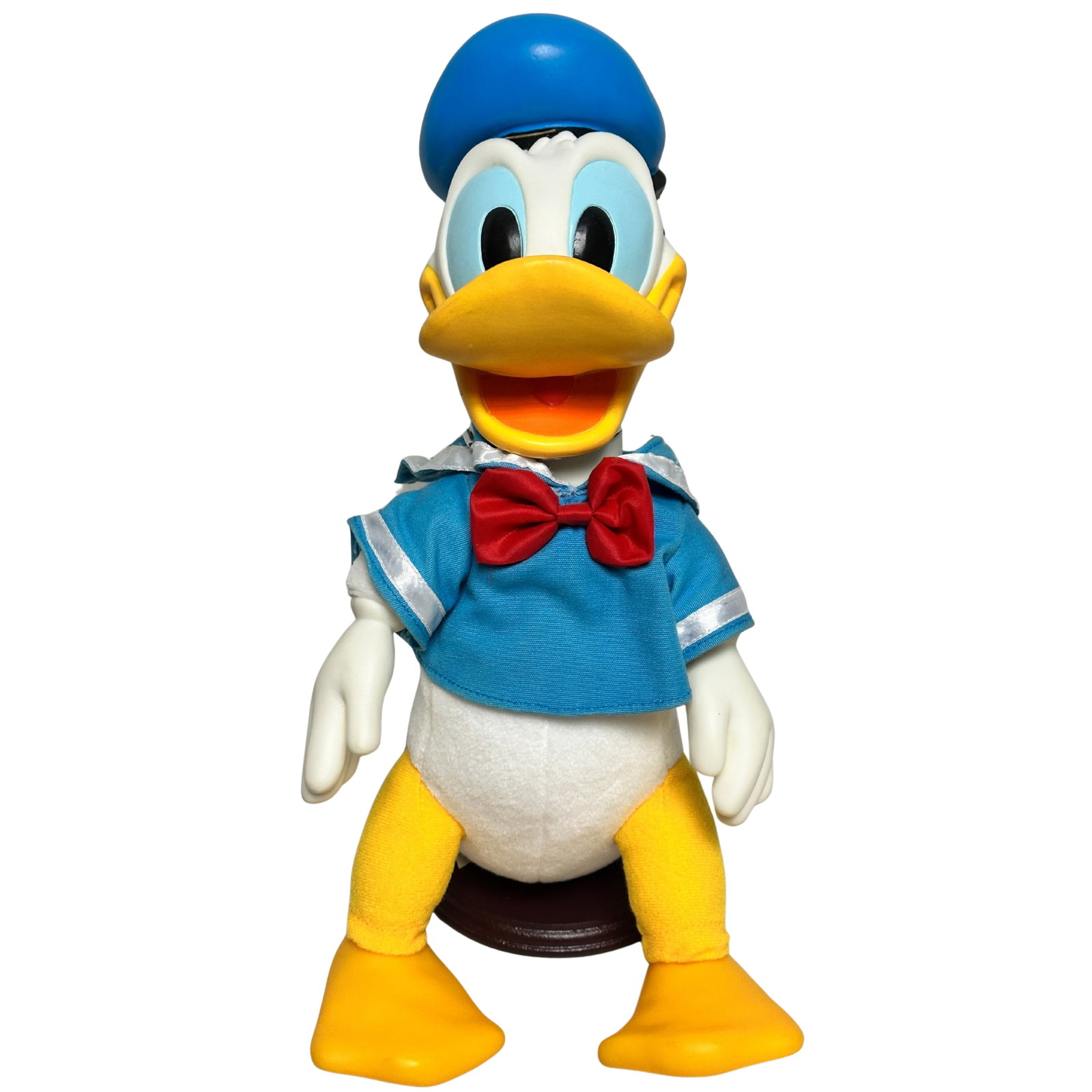 Disney Mouseketoys Donald Duck Plush: Disney Mouseketoys Donald Duck Plush. This piece features This features Donald Duck wearing his iconic blue sailor suit shirt with a red bowtie, and sailor cap, his hands and feet are a harder plastic