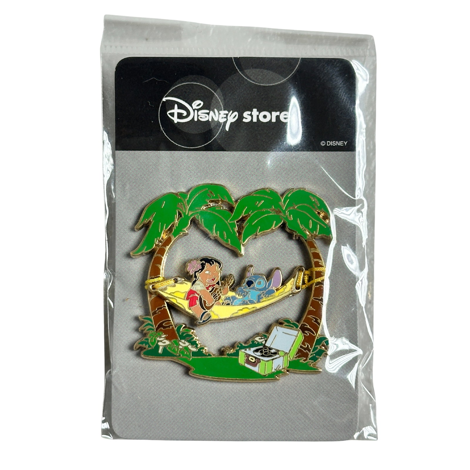 Disney JDS Aloha Stitch Lilo & Stitch Hammock Pin: Disney JDS Aloha Stitch Lilo & Stitch Hammock Pin. This pin released from JDS. Lilo and Stitch are on a yellow hammock connected by strings to palm trees. Lilo is playing an ukulele and there is a gre