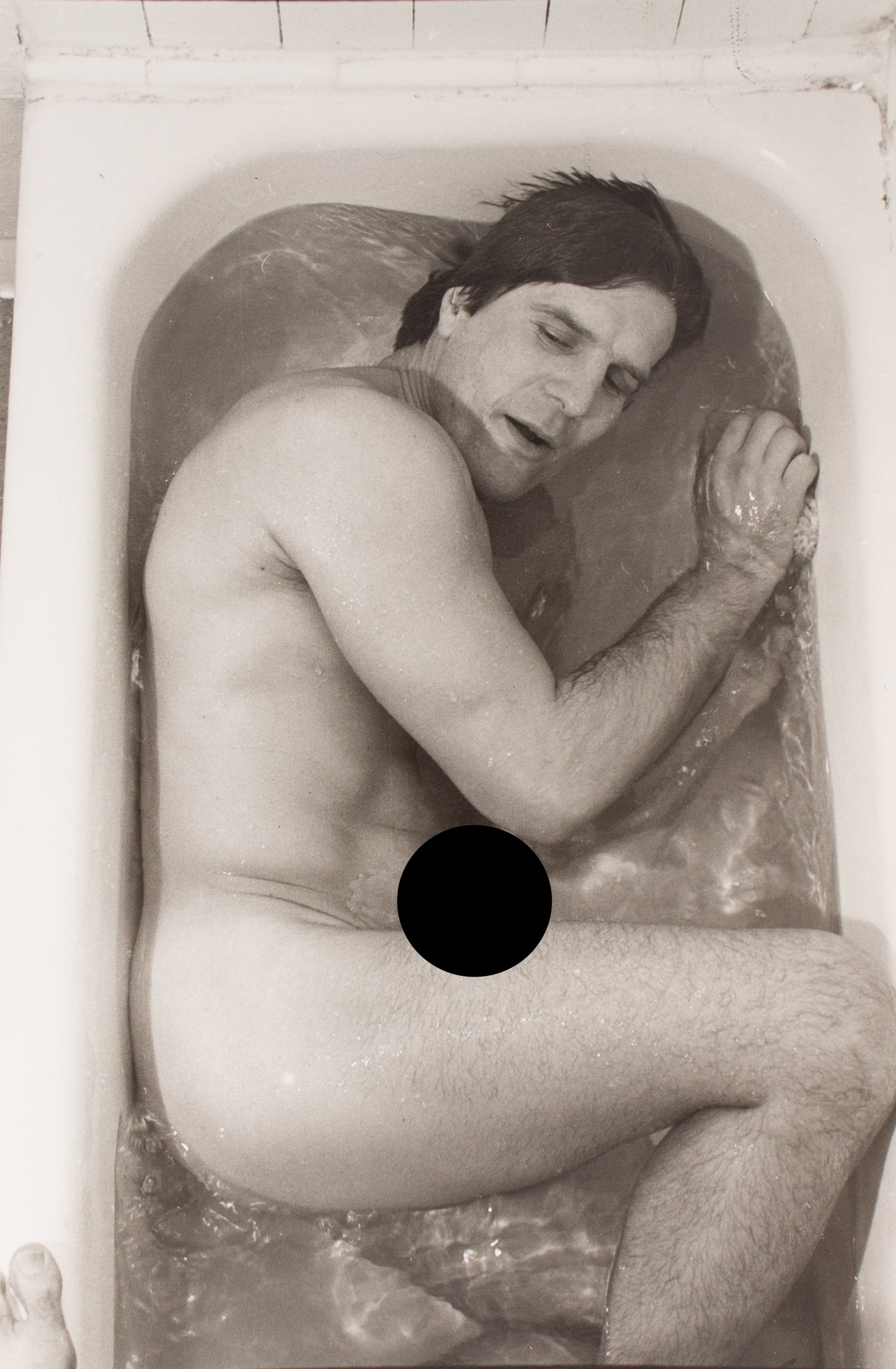 Don Herron 1978 "Dave Kopay" Tubshots Photograph: Black and white photograph by photographer Don Herron (American; 1941-2012). This photograph was taken as part of the artist's Tubshots series, which encompassed a collection of bathtub 