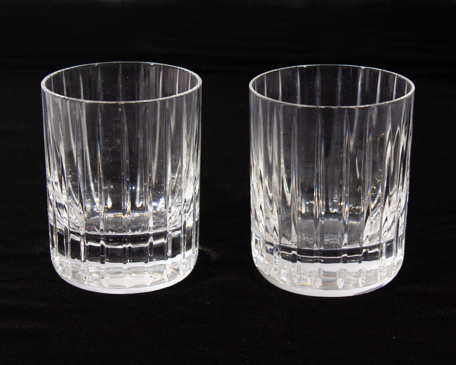 Baccarat France Crystal "Harmonie" Tumblers: Pair of crystal "Harmonie" tumblers produced by Baccarat. Marked to underside. Baccarat made these tumblers in five sizes and this particular pair is the "small" size. Measurements