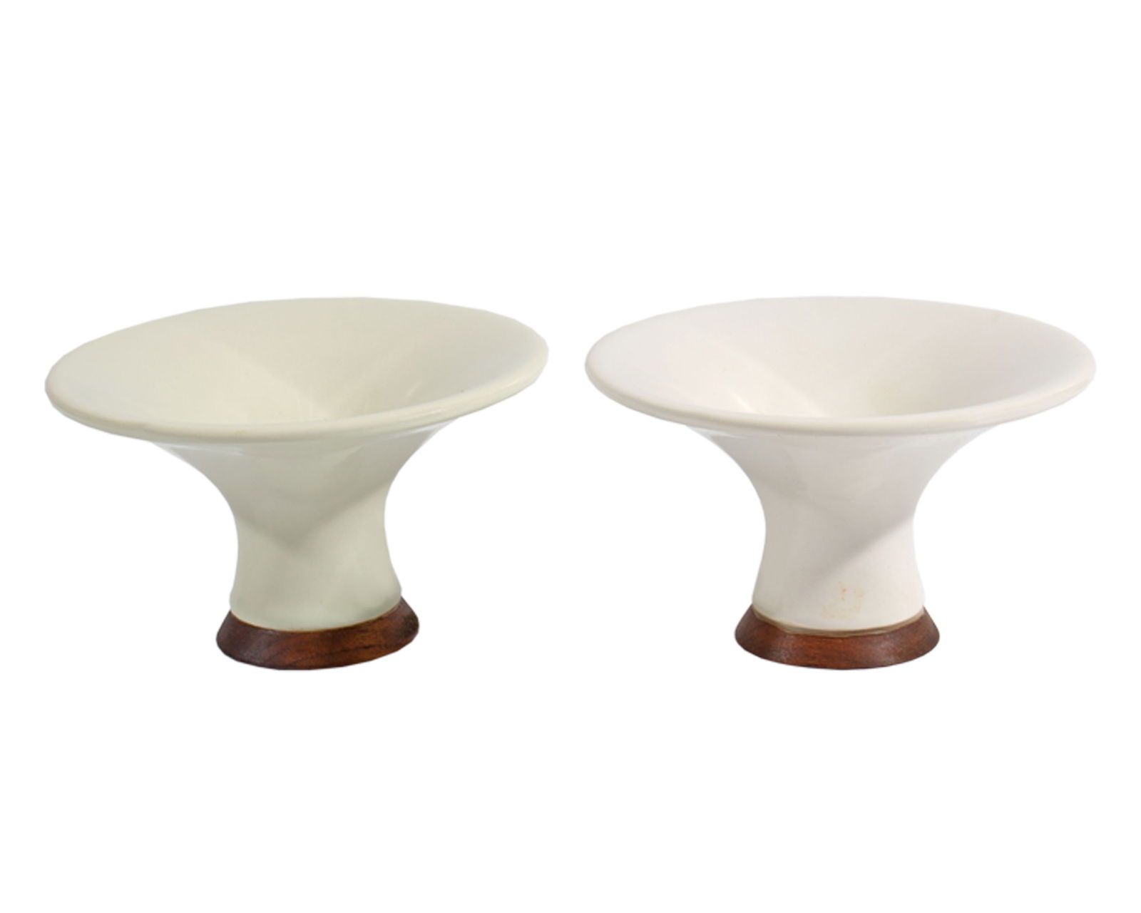 Michael Lax Hyalyn “Capri" for Raymor Candlestick Holders: Mid-century pair of Capri candlestick holders designed by the industrial designer Michael Lax (American; 1929-1999) for Hyalyn and distributed by Raymor. Each round white porcelain bowl-shaped