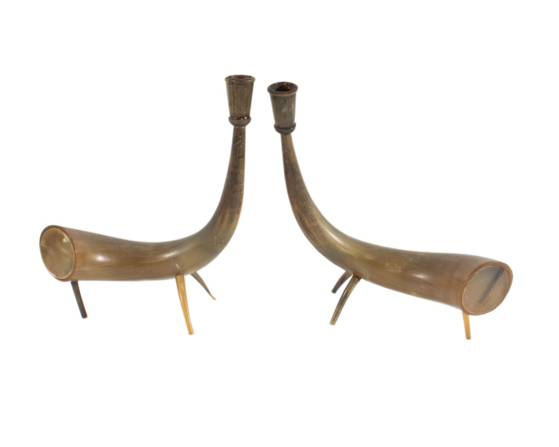 Vintage Horn Candlestick Holders: Pair of vintage horn candlestick holders. Measurements: 8.5” W x 11” H x 3.75” D (smaller holder), 10” W x 10.5” H x 3.5” D (larger