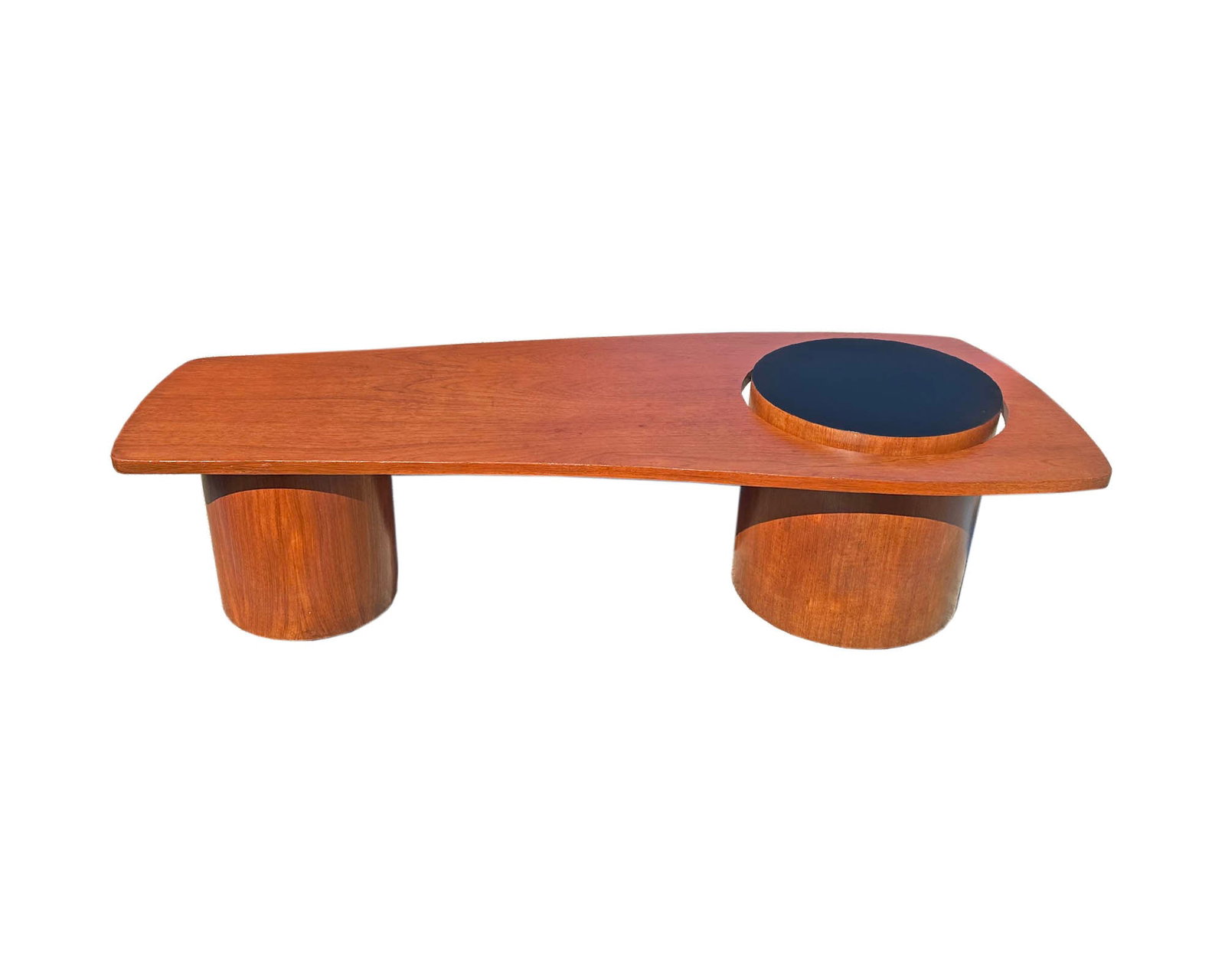 RS Associates 1960s “Martini" Coffee Table: 1960s "Martini" coffee table designed by RS Associates. Originally designed for the 1967 Montreal World's Fair. Table has a teak veneer and two cylinder-shaped supports. One of the supports juts throu