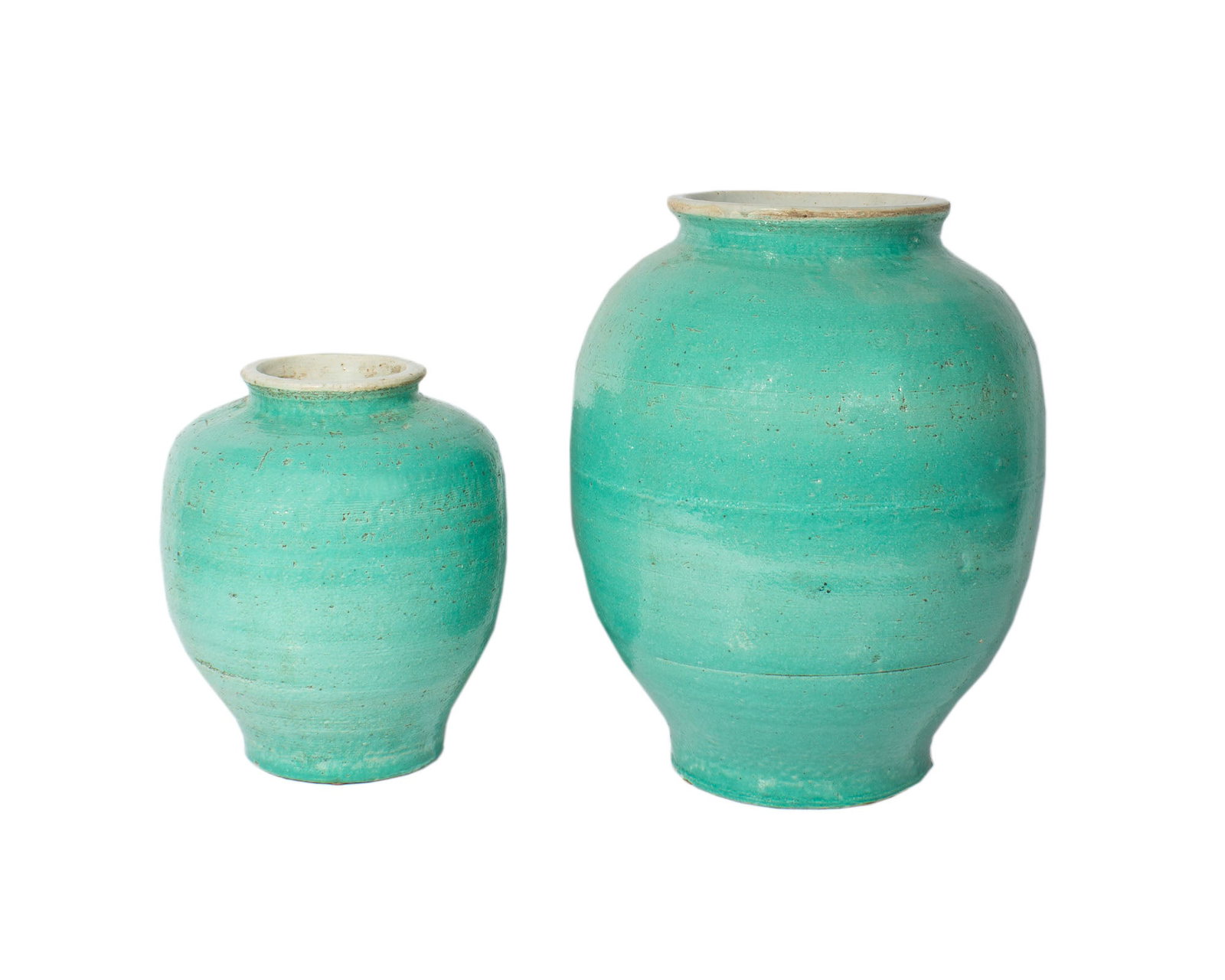 Chinese Monochrome Vases: Two Chinese monochrome vases. Unmarked. Measurements: 12" W x 16" H x 12" D. In house shipping available.