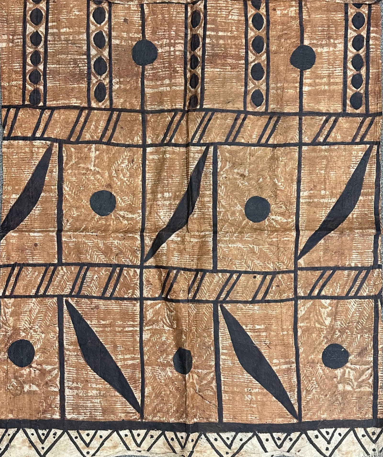 Tapa Polynesian Bark Cloth: Polynesian tapa bark cloth with geometric design. Created by pounding the bark of the mulberry tree to create a fibrous paper fabric. Measurements: 34" H x 43" W. In house