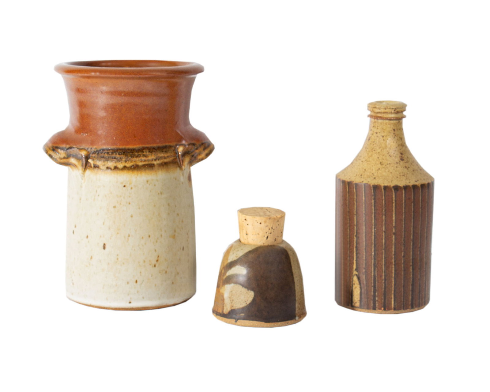 Indiana Studio Pottery: Three pieces of studio pottery by Indiana ceramic artists. Included is a Bethel Pike jar with cork, a bottle-shaped vase by John Bauman, and a Scott Shafer double handle vase. Each piece signed/marked