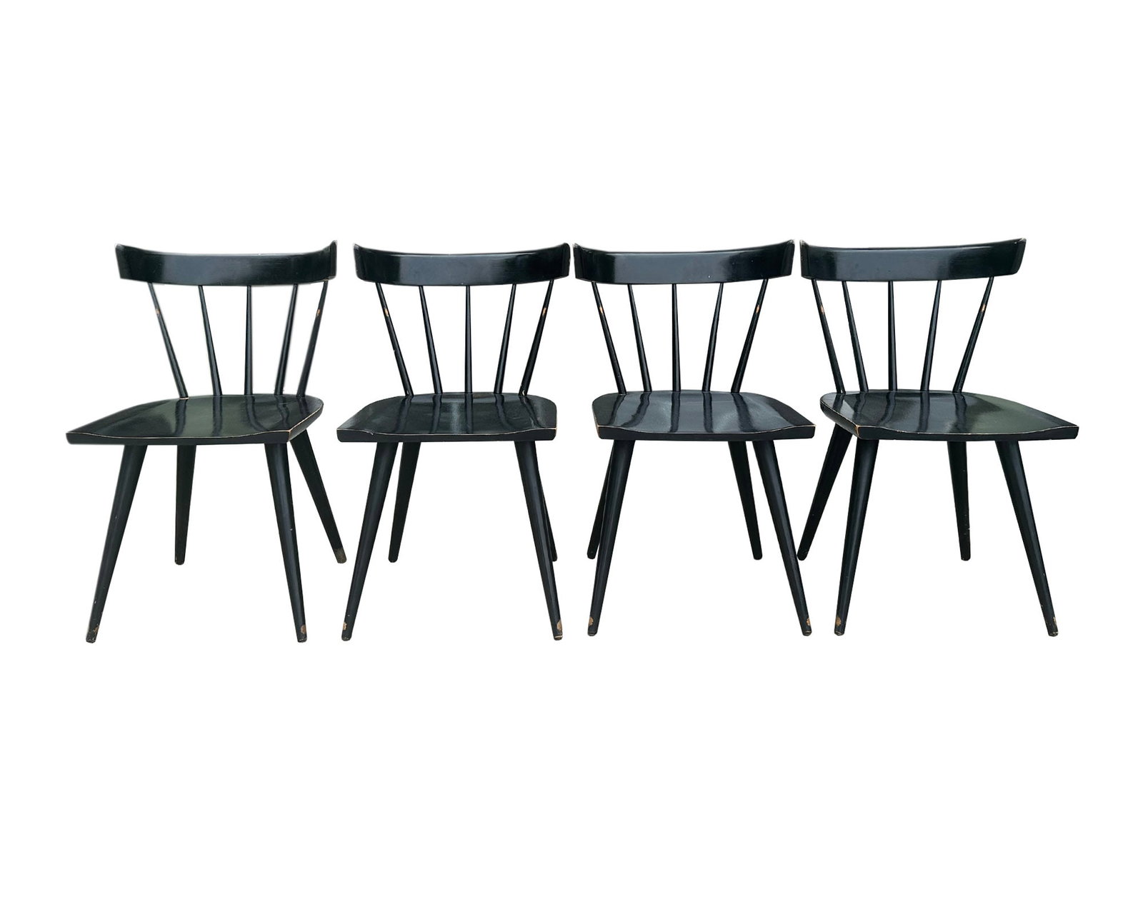 Paul McCobb Planner Group Black Dining Chairs: Set of four Planner Group dining chairs in black designed by Paul McCobb (American; 1917-1969). Two chairs marked to the underside. Measurements: 19.5" W x 31" H x 20" D (single 