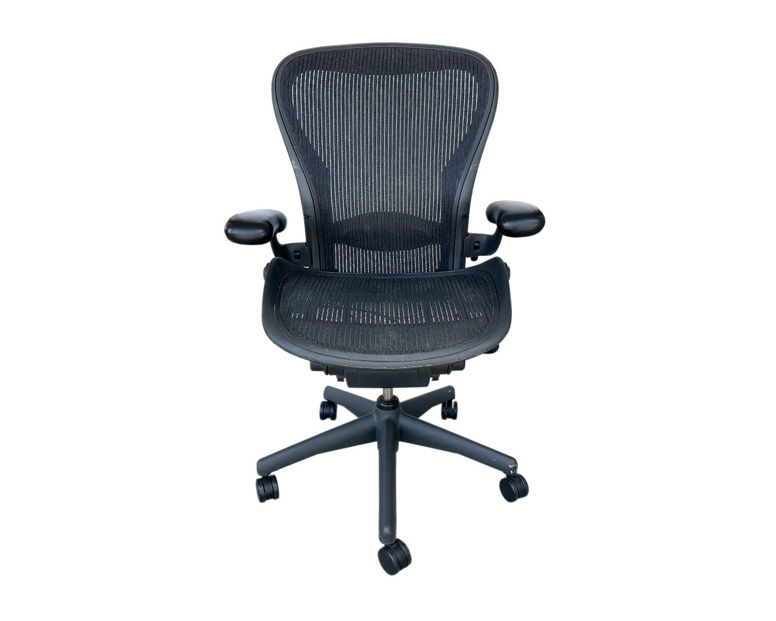 Herman Miller Aeron Office Chair: Aeron office chair produced by Herman Miller. Marked to back. Measurements: 25.5" W x 43" H x 24" D. Pickup or third party shipping required.