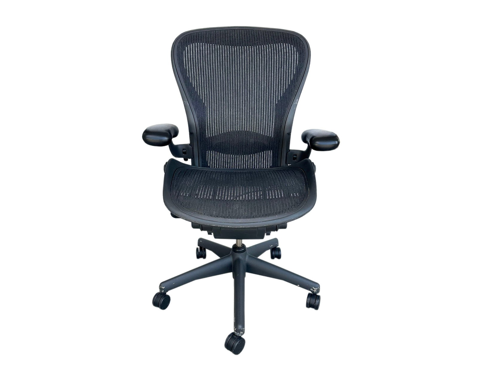 Herman Miller Aeron Office Chair: Aeron office chair produced by Herman Miller. Marked to back. Measurements: 25.5" W x 43" H x 24" D. Pickup or third party shipping required.