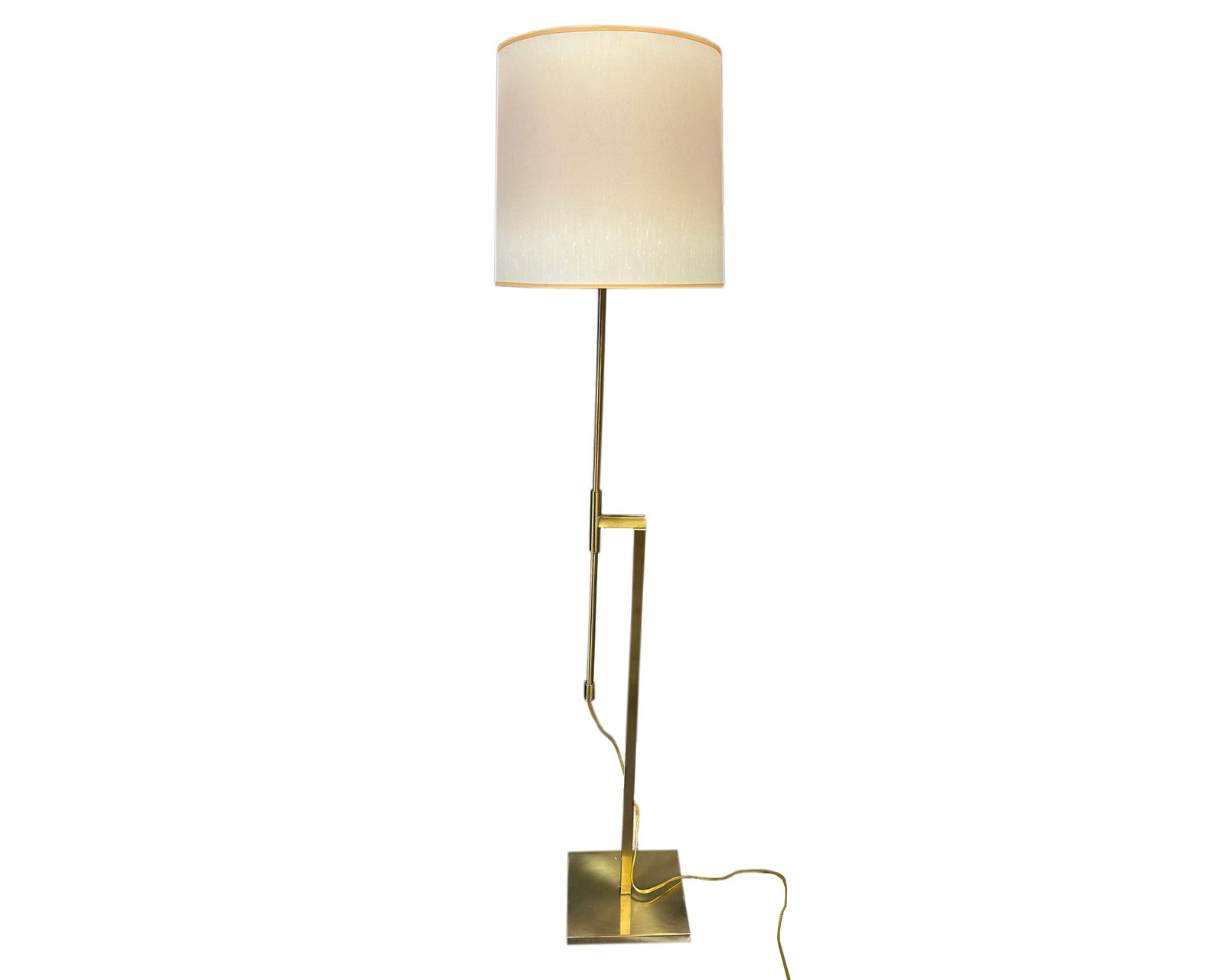 Laurel Lamp Brass Tone Adjustable Floor Lamp: Brass tone metal adjustable floor lamp produced by Laurel Lamp. Lamp has bar that can slide up and down to adjust the height of the lamp. The off-white lamp shade is original to the lamp and is m