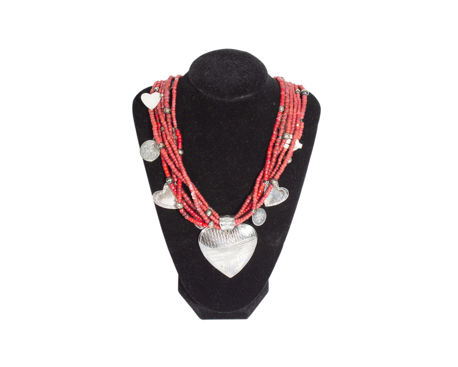 Don Lucas Sterling Six Strand Beaded Necklace: Six strand red bead necklace with sterling charms by jewelry artist Don Lucas. Signed "D. Lucas" to back of largest heart charm. Measurements: 24.5" W (necklace fully stretched