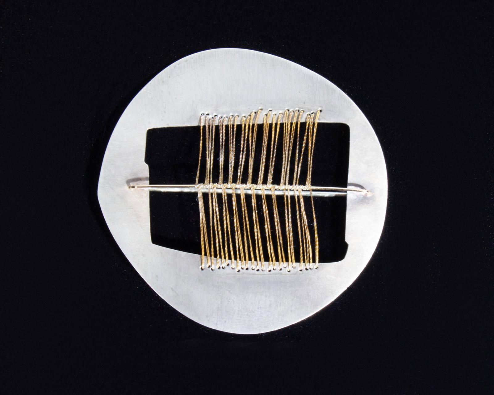 Carolina Cole 1980s Sterling Brooch with Thread: 1980s sterling silver brooch with thread by jewelry artist Carolina Cole. Marked "Cole Sterling" to back. Measurements: 2.5" W x 2.5" D; 0.37 ozt (total weight). In