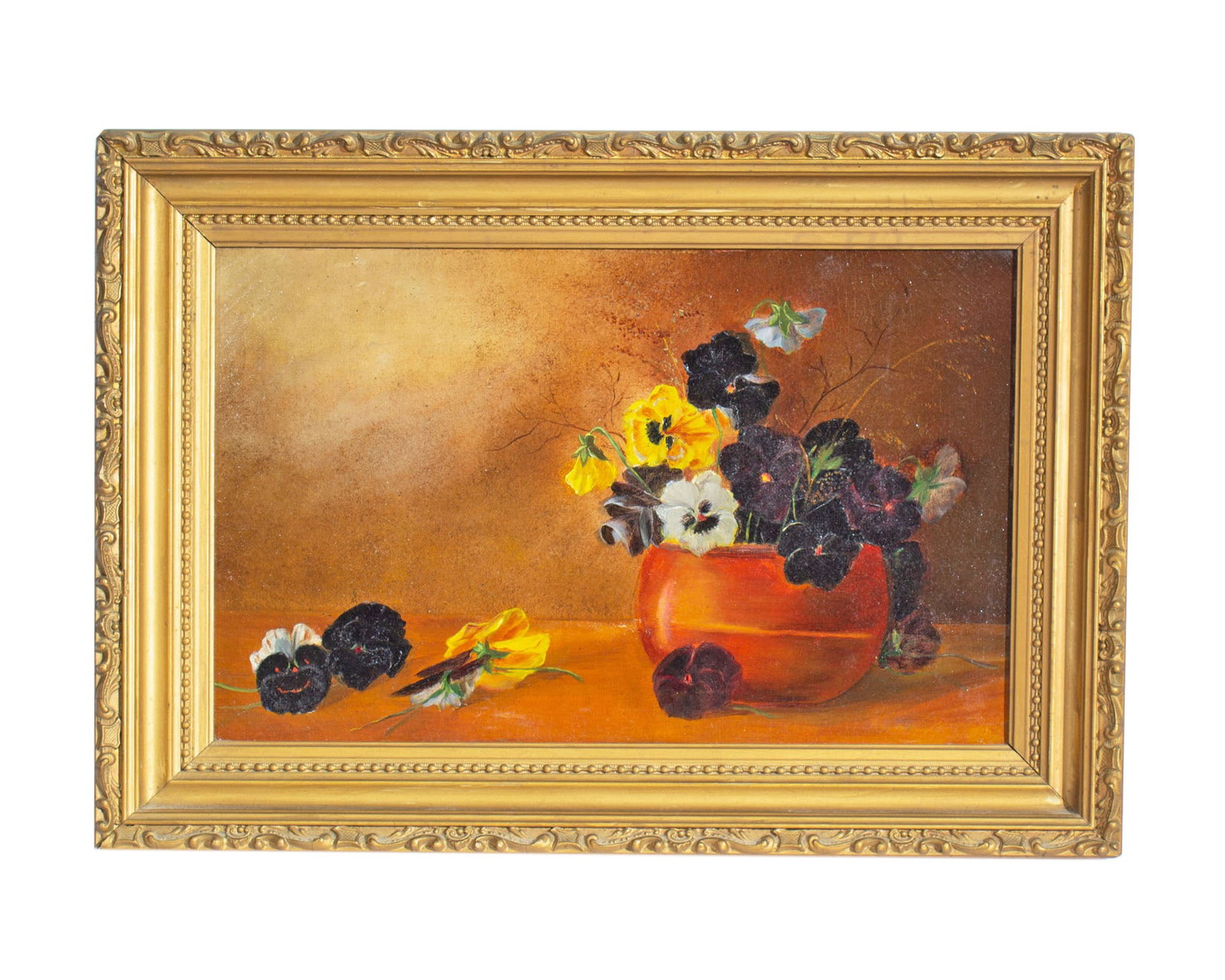 Early 20th Century Oil on Canvas Painting of Pansies: Early 20th century oil on canvas still life painting of pansies. Unsigned. Measurements: 19.75" W x 13.75" H x 2.5" D (frame). In house shipping available.