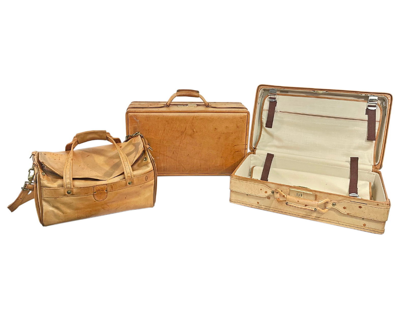 Vintage Hartmann Leather Luggage: Set of vintage Hartmann Luggage. Made of leather. Small duffel bag comes with its original lock and keys. One suitcase has its original pamphlet with explanation on how to set the combination lock.