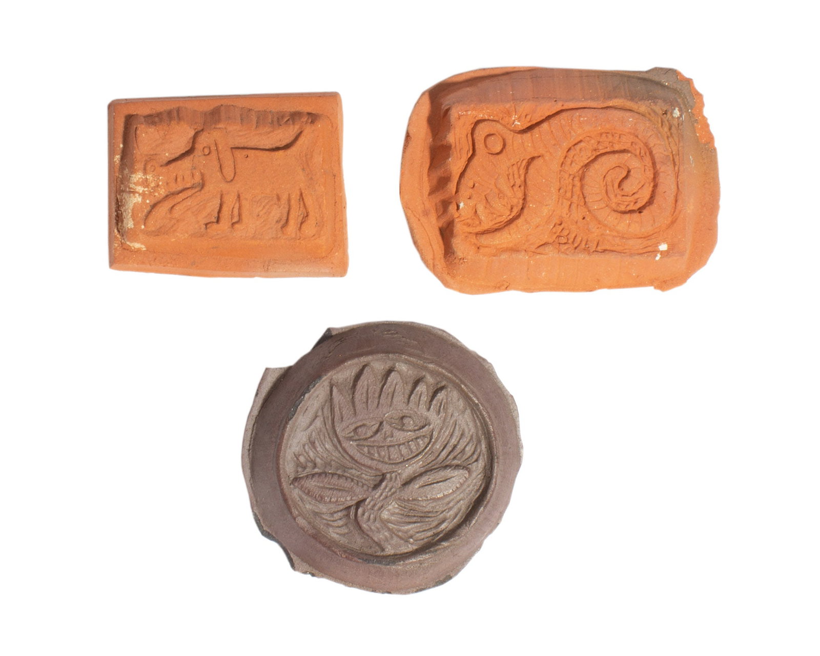Mark Bulwinkle Studio Pottery Tiles: Group of three studio pottery tiles by Mark Bulwinkle (American; born 1946). Included is a tile of a snake, a dog, and a plant Each marked "MB" verso. Measurements: 2.75" W 