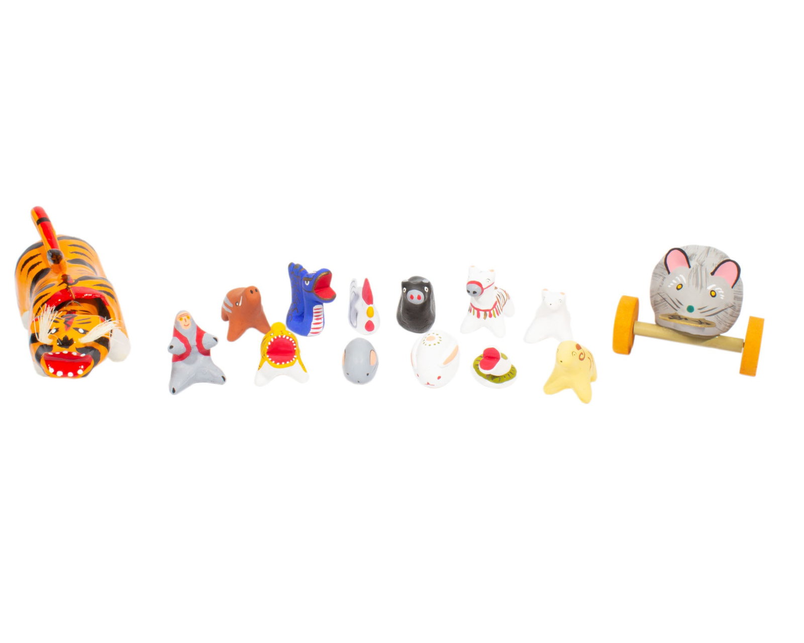 Japanese 1980s Lunar Zodiac Hariko and Ceramic Figurines: Group of lunar zodiac figurines made in Japan during the 1980s. Included is a set of 12 ceramic figurines representing each lunar zodiac sign. Also included is a hariko paper-mache zodiac rat and
