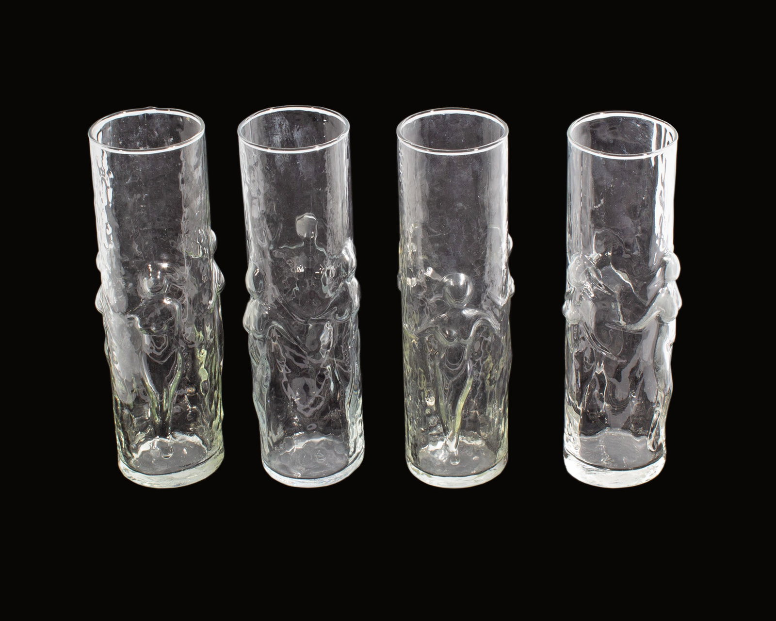 Libbey "La Femme" Glass Set: Set of four "La Femme" glasses produced by Libbey. Measurements: 2.75" W x 8.75" H x 2.5" D (single glass). In house shipping available.