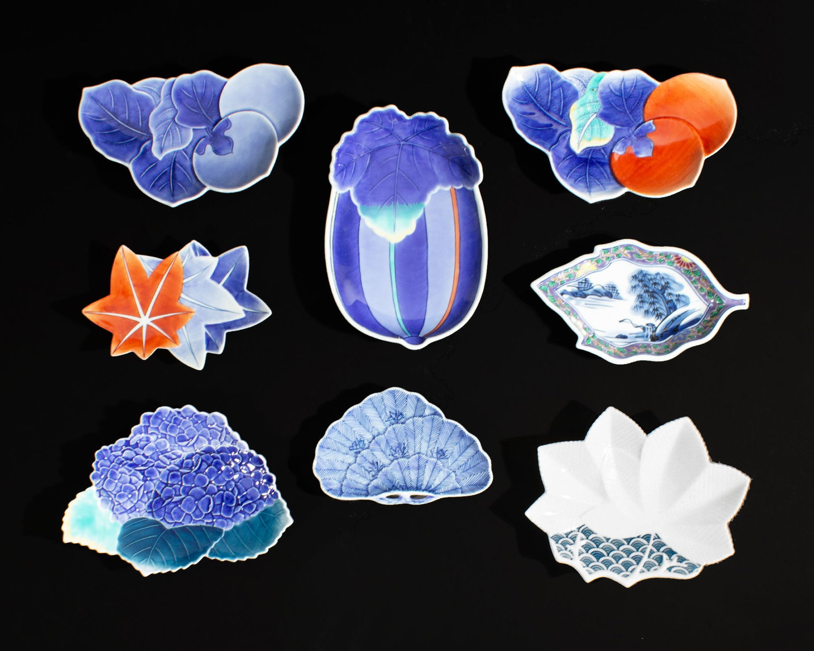 Nabeshima Ware Japanese Porcelain Dishes: Group of eight porcelain Japanese dishes. Included are several Nabeshima ware dishes, an Arita ware dish, and more. Each piece marked to the underside. Measurements: 7" W x 1.25" H x
