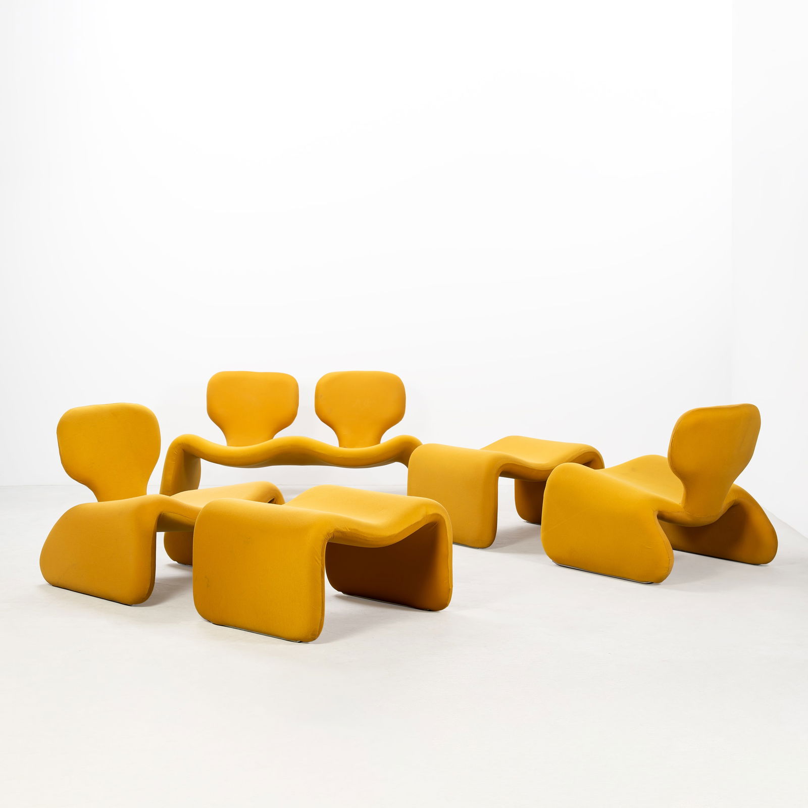 OLIVIER MOURGUE, A 'DJINN' SETTEE PAIR OF ARMCHAIRS AND PAIR OF OTTOMANS: Nylon upholstery, steel, manufactured by Airborne International, France, designed 1965, settee 63 x 125 x 65 cm, armchairs 63 x 65 x 65 cm, ottoman 63 x 57 x 67 cm, Literature Philadelphia Museum of A