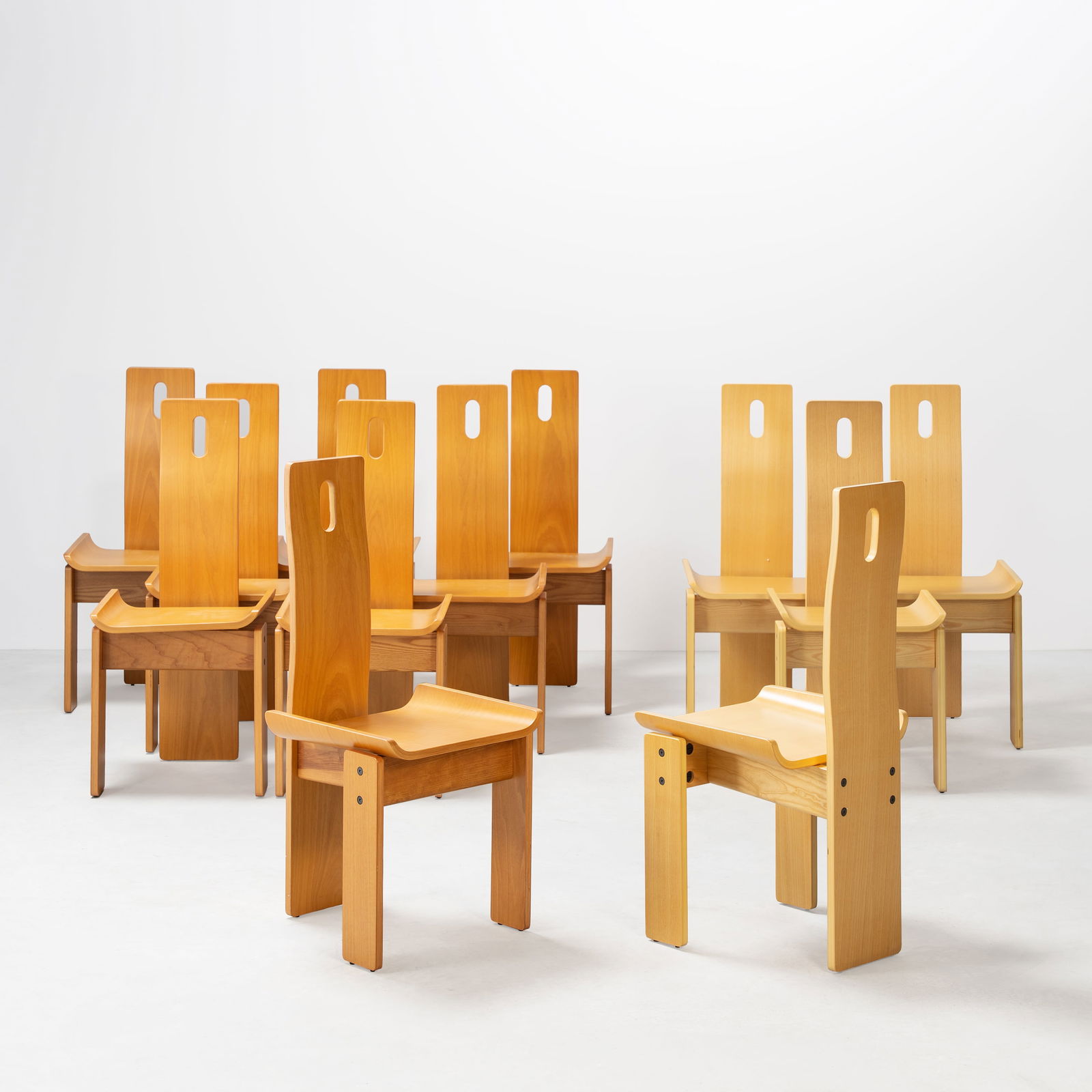 EDOARDO LANDI, TWELVE 'DIAGO' CHAIRS: Eight chairs in walnut, four in ashwood, steel, produced by Nikol International, Italy, 1970s, 100 x 45 x 49 cm