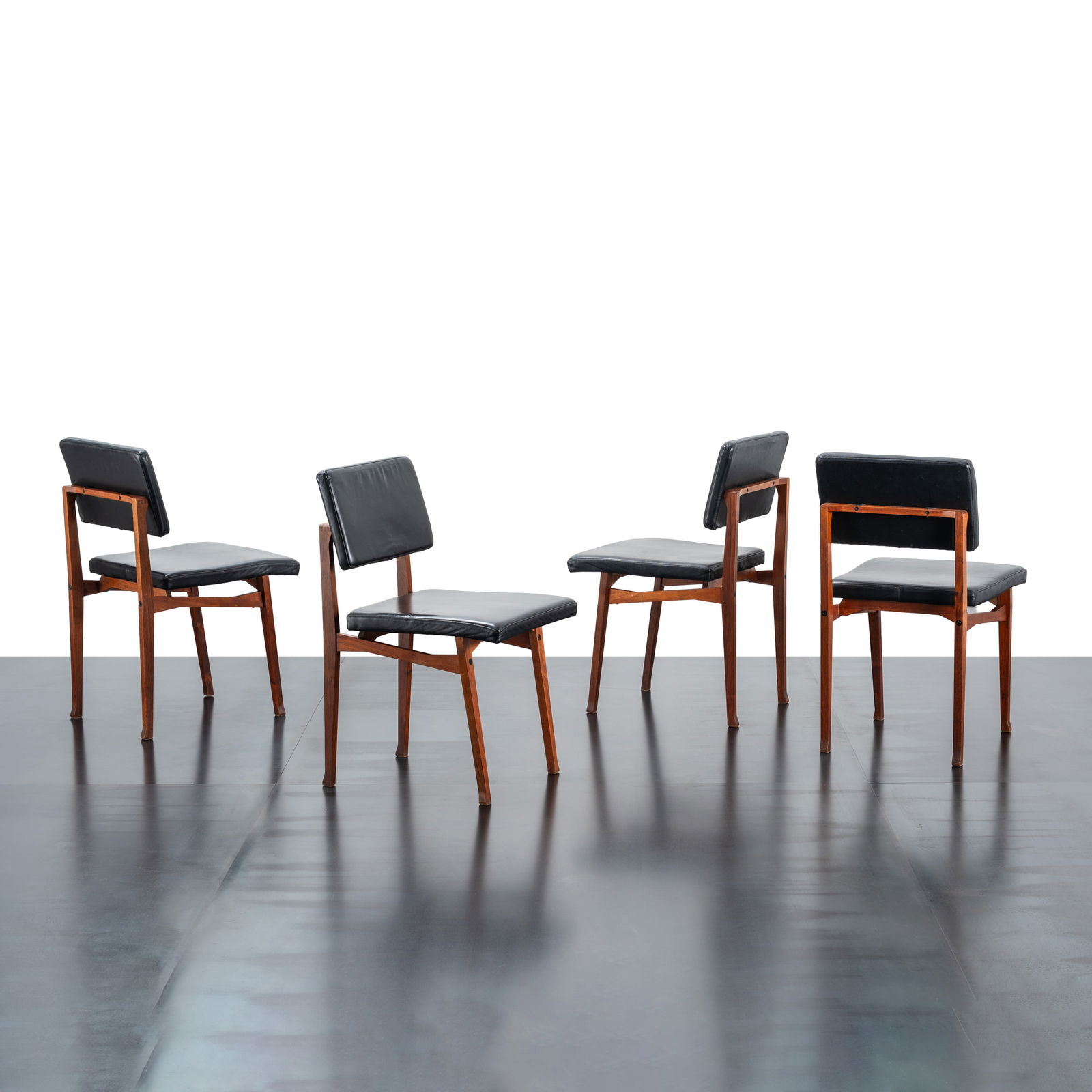 FRANCO ALBINI SET OF FOUR LUISELLA CHAIRS: Wood and leather upholstery Manufactured by Poggi Italy circa 1956 80 X 43 X 50.5 cm Literature Domus No. 729 July 1991 p. 65