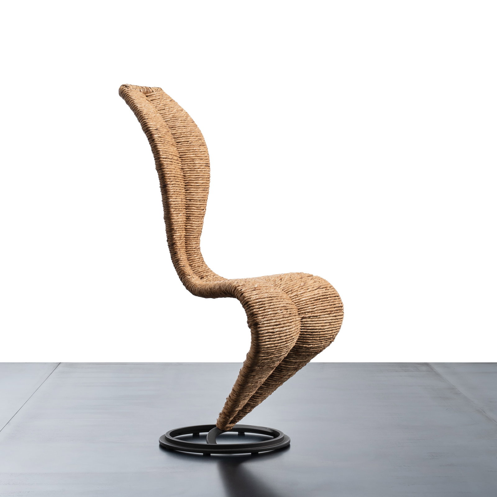 TOM DIXON \“S-CHAIR\?? CHAIR: Metal and woven wicker Manufactured by Cappellini Italy designed in 1991 mark on the base 104 X 48 X 40 cm Literature G. Gramigna Repertorio del design italiano 1950-2000 (Repertory of Italian Design 