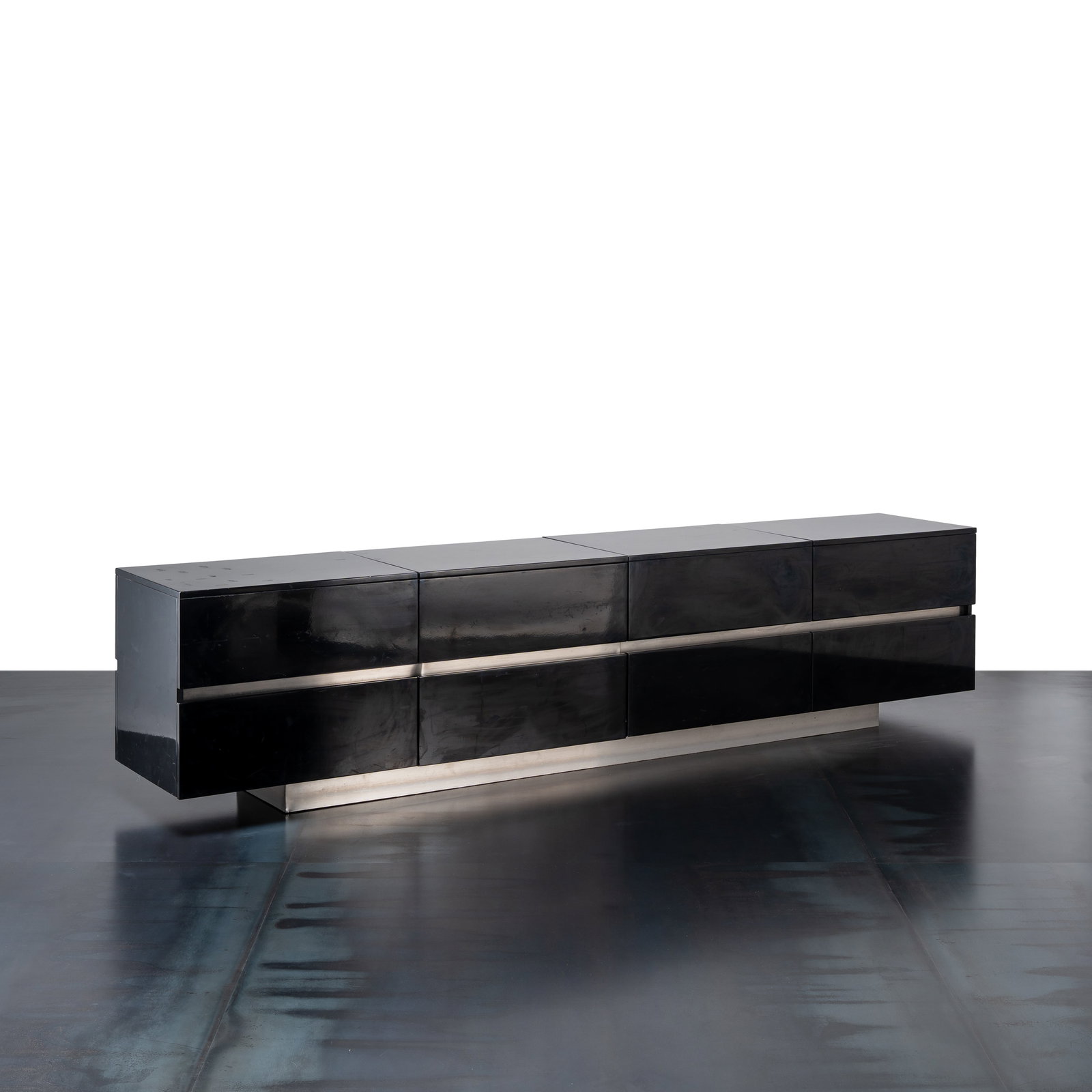 LUIGI SACCARDO SIDEBOARD: Glossy black and white lacquered wood. The upper section comprises four storage compartments that open from the top; the lower section features four deep drawers Manufactured by Arrmet Italy 1980s 66 