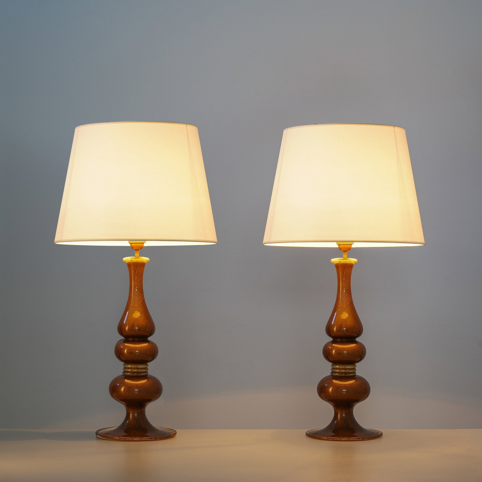 BAROVIER & TOSO PAIR OF TABLE LAMPS: Glass with gold leaf 52 x 19 cm in diameter manufacturer's label on the base