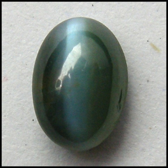 0.78Cts~NATURAL Color change ALEXANDRITE CAT'S EY: STONE NAME : ALEXANDRITE CAT'S EYE , LOT NO : ACE 236 - 26 (1270) , Quantity: 1PCS , WEIGHT CTS : 0.78 CTS , SIZE : 5.8 X 4.7 X 2.1 MM , COLOR : CHANGE COLOR , SHAPE : OVAL , CLARITY : IF , ORIGIN : R