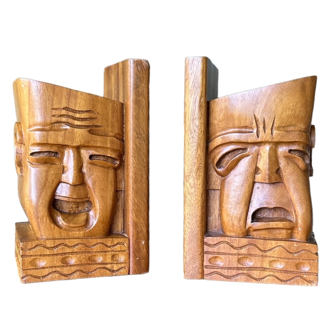 Hand Carved Mahogany Vintage MCM Bookend Set Of Comedy & Tragedy Theatre: This vintage bookend set is a true gem for any collector or theater enthusiast. Crafted from beautiful mahogany wood, these bookends feature intricate carvings of comedy and tragedy masks, perfect for