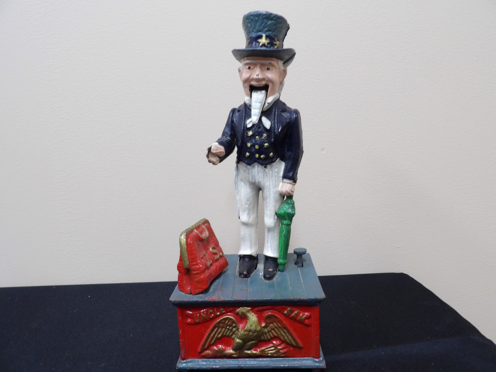 Vintage Cast Iron Coin Bank Uncle Sam: Signs of wear.