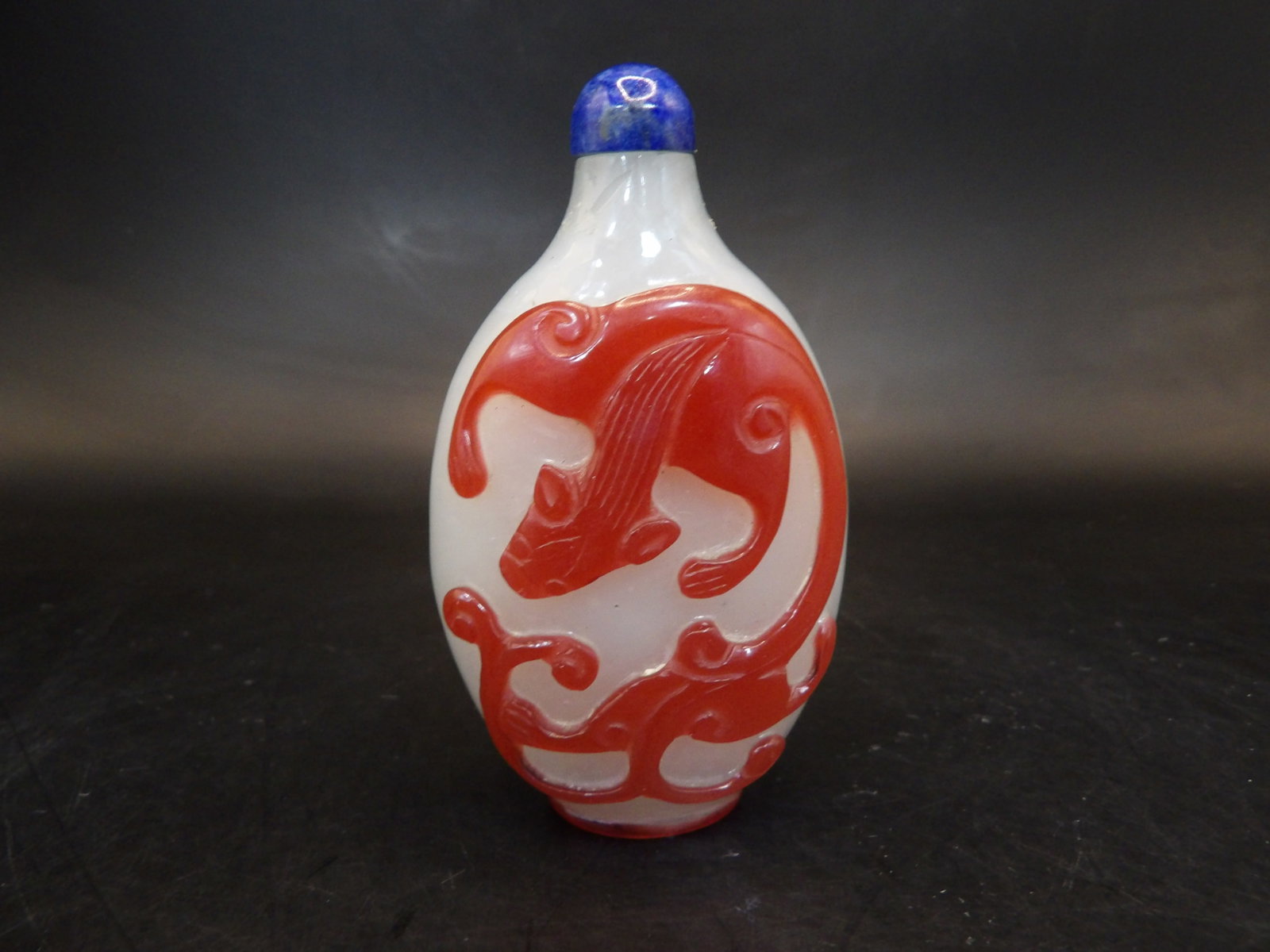 Antique Chilong red overlay glass snuff bottle: 2.8 inches height.Lapis lazuli stopper.