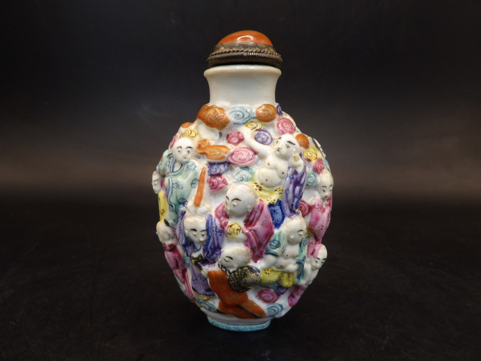 Qing dynasty Qianlong 4- character mark molded porcelain arhat snuff bottle: 2.9 inches height.