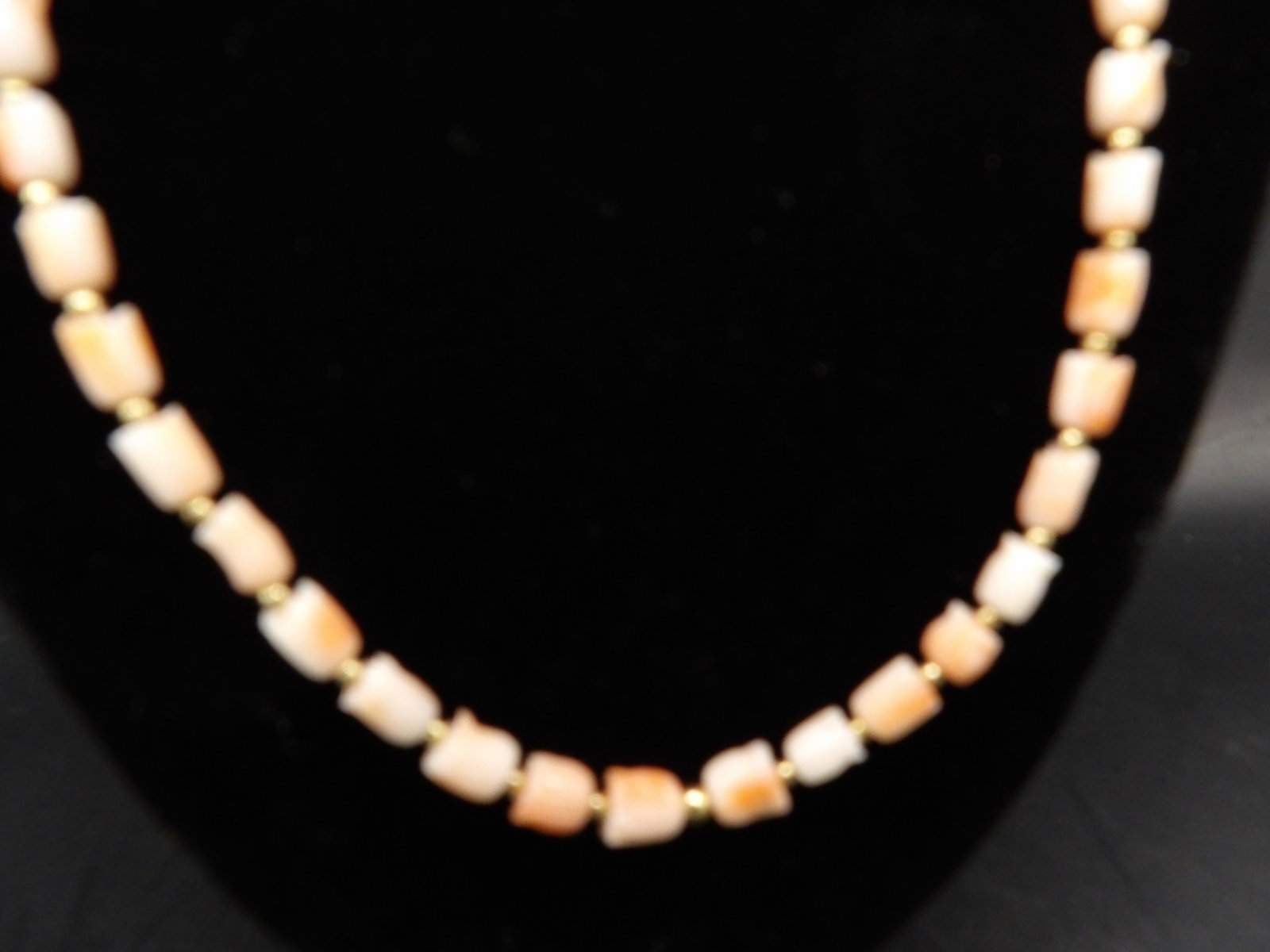 Angel skin coral carved tulip shaped 20 inches long necklace: 14 grams. 20 inches long.