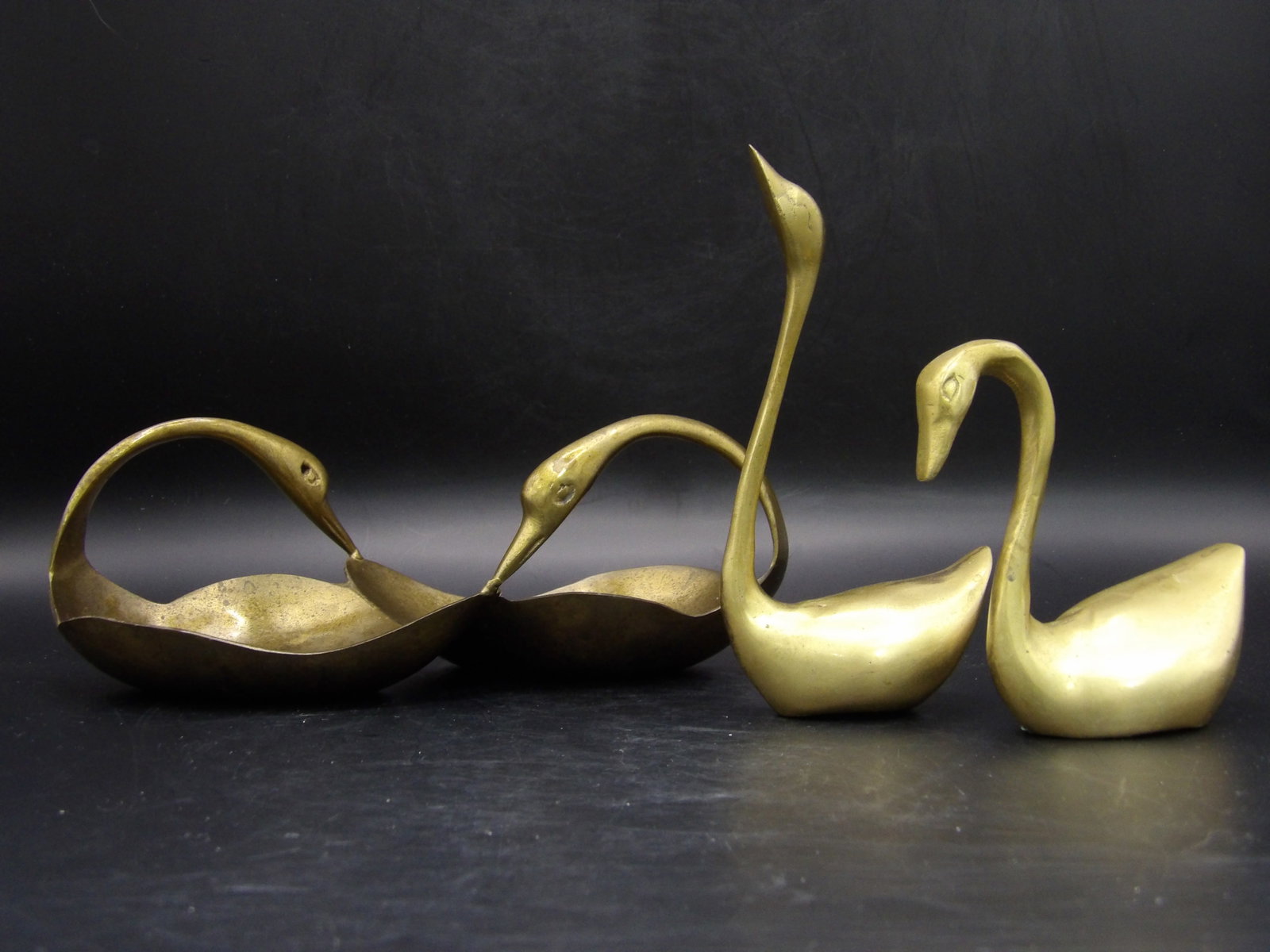 Mid Century Brass Swan Statue x 2 and Indian Swan Tray Lot of 3: Lot of 3. Swan Tray has Indian marking. Taller swan is over 5 inches height. Swan tray is 8 inches long.