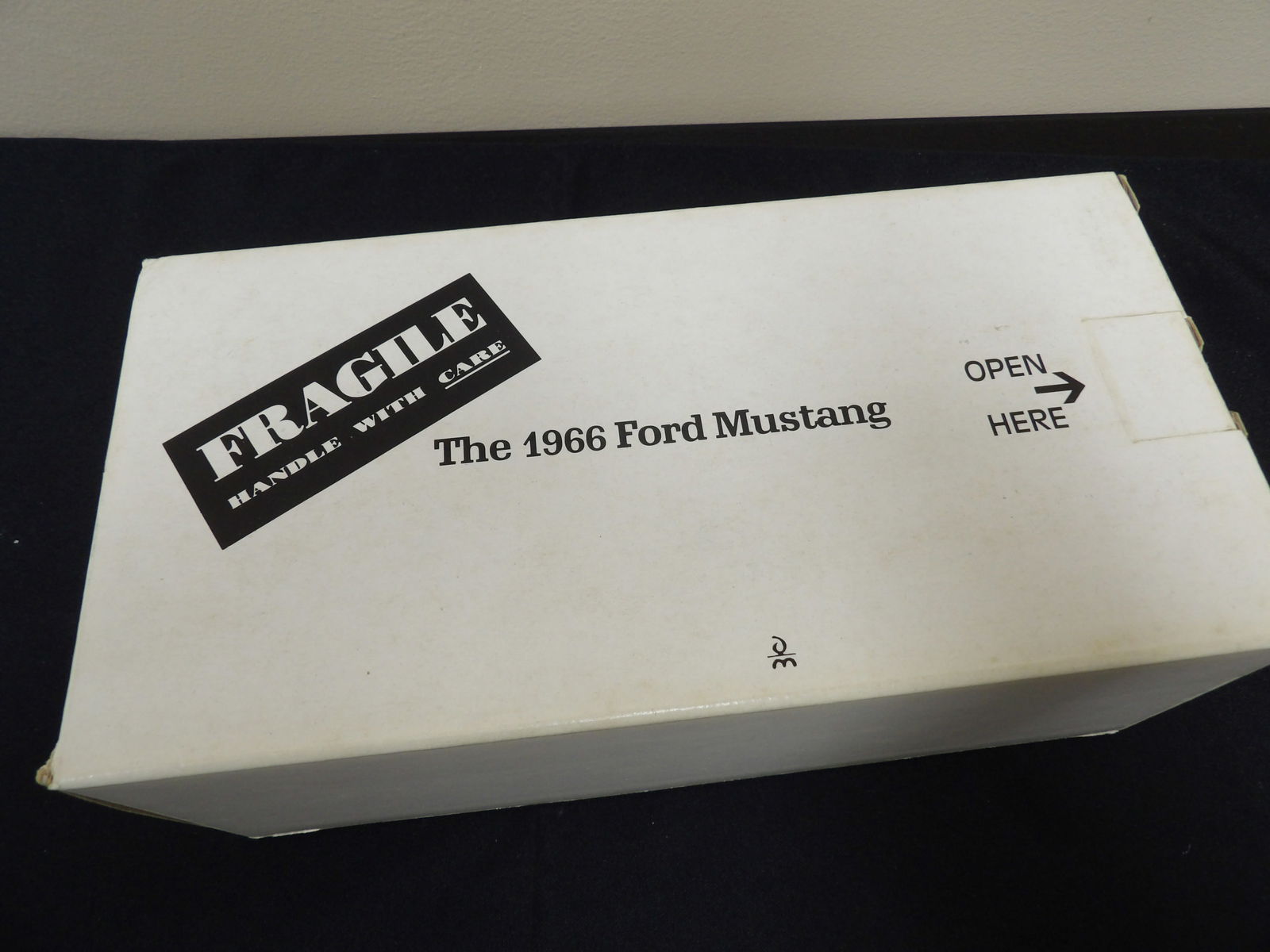 The 1966 Ford Mustang in box: 7.5 inches length scale car in 10.3 inches length box.