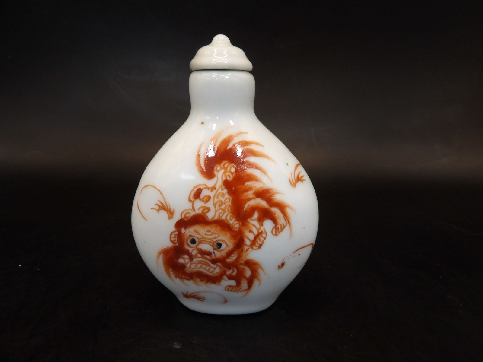 Chinese iron red hand painted foo dog porcelain snuff bottle with mark (1 of 5)