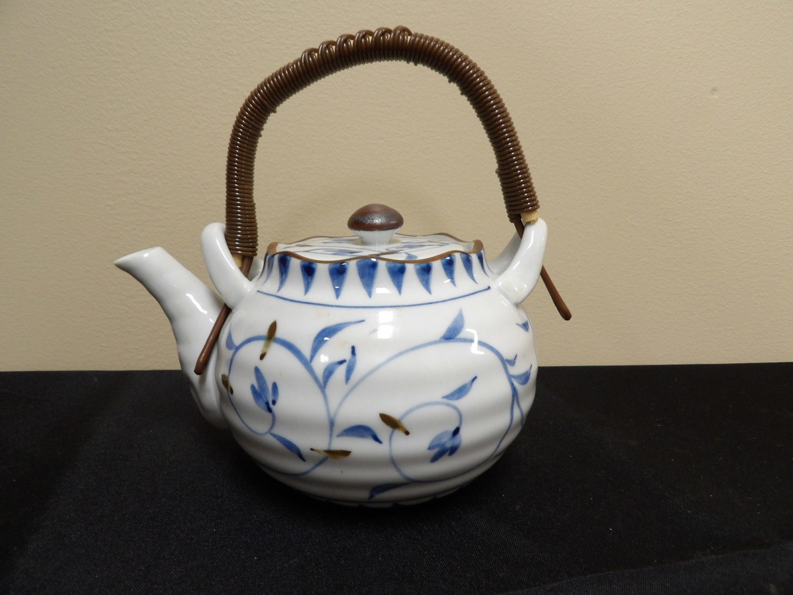 Japanese Teapot Signed: With strainer. Signed. 7 inches length.