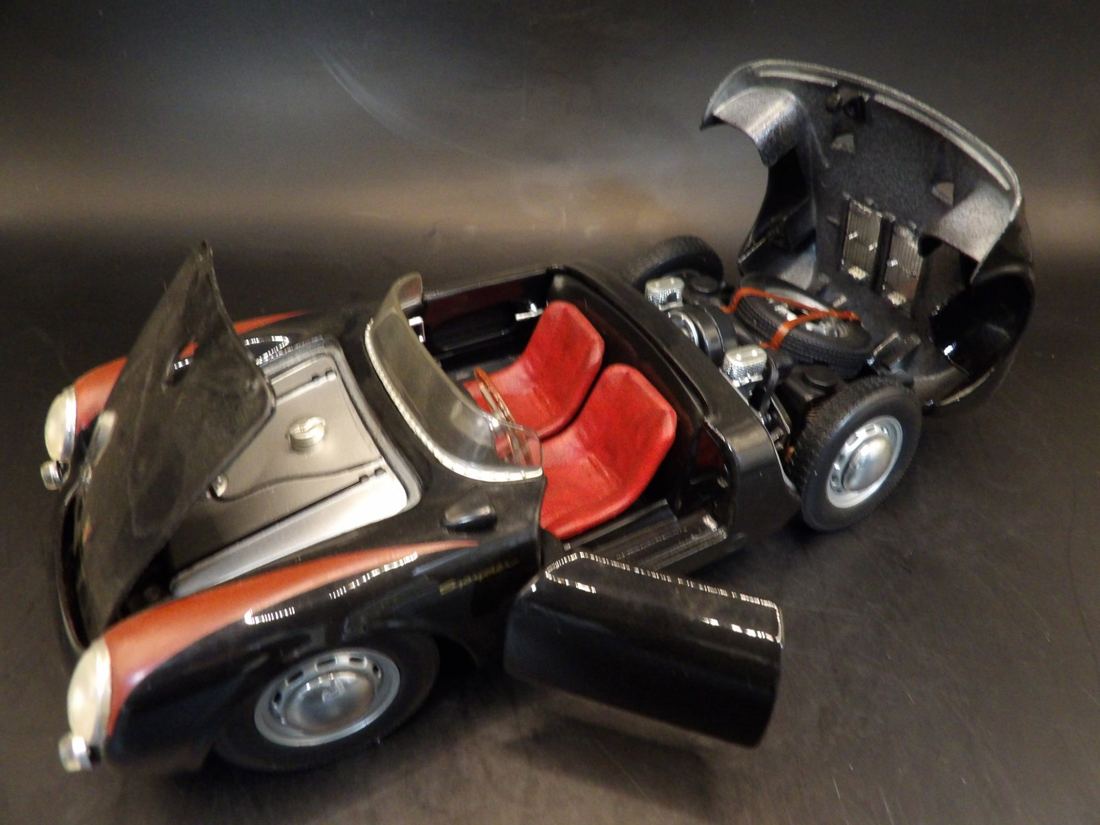 Maisto 1:18 Porsche 550A Spyder made in Thailand: 8 inches length. Spare tire is in back trunk.