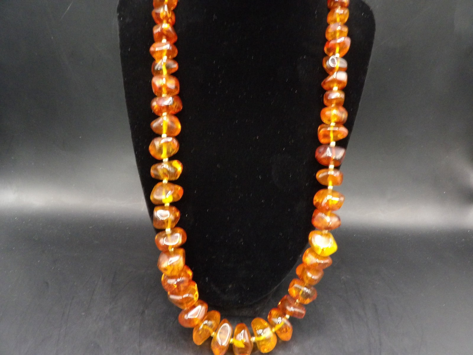 Chinese amber necklace: 24.5 inches. 74 grams.
